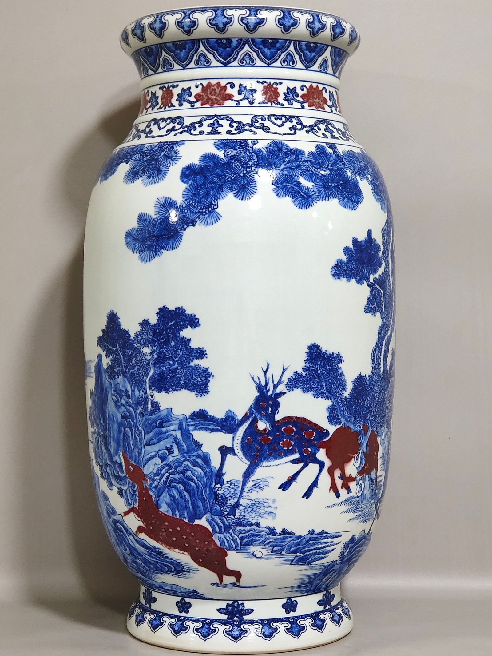 Qing Dynasty Qianlong blue and white underglaze vase with red pine and deer pictures