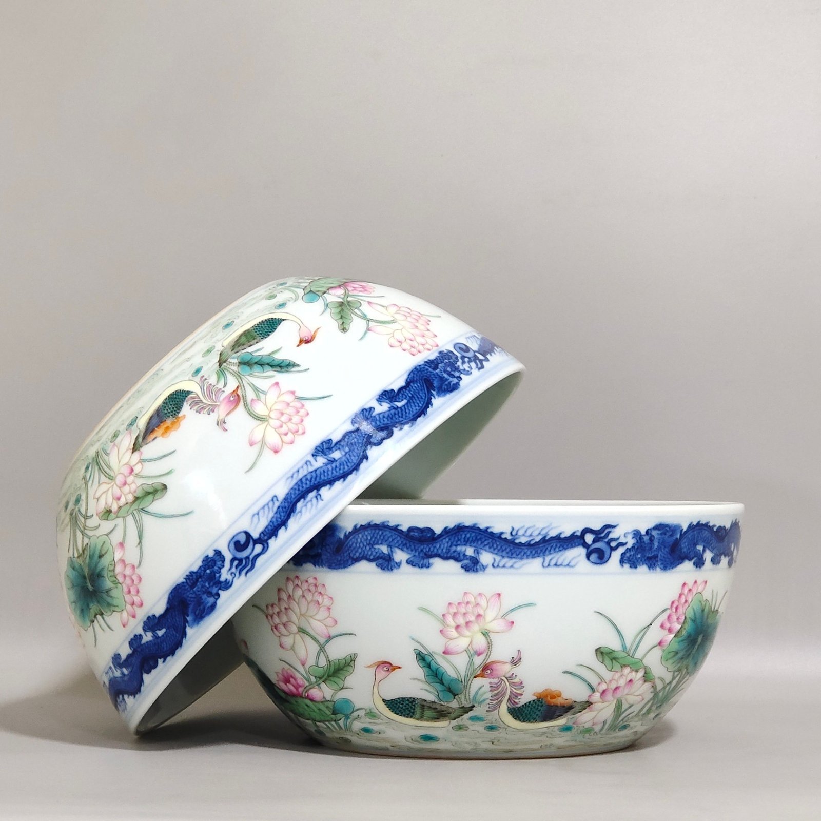 Qing Dynasty Qianlong blue and white dragon-patterned lotus bowl with mandarin ducks