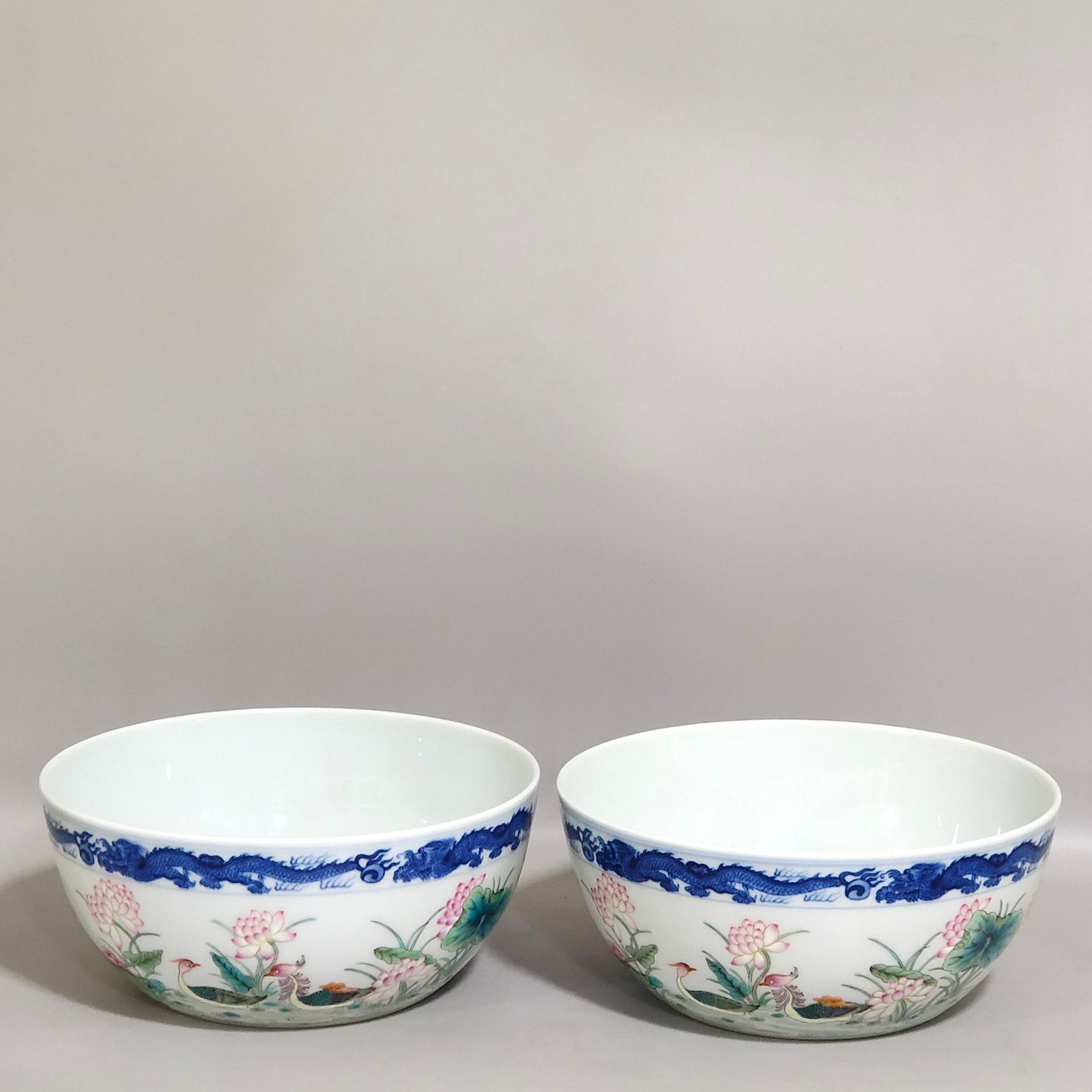Qing Dynasty Qianlong blue and white dragon-patterned lotus bowl with mandarin ducks