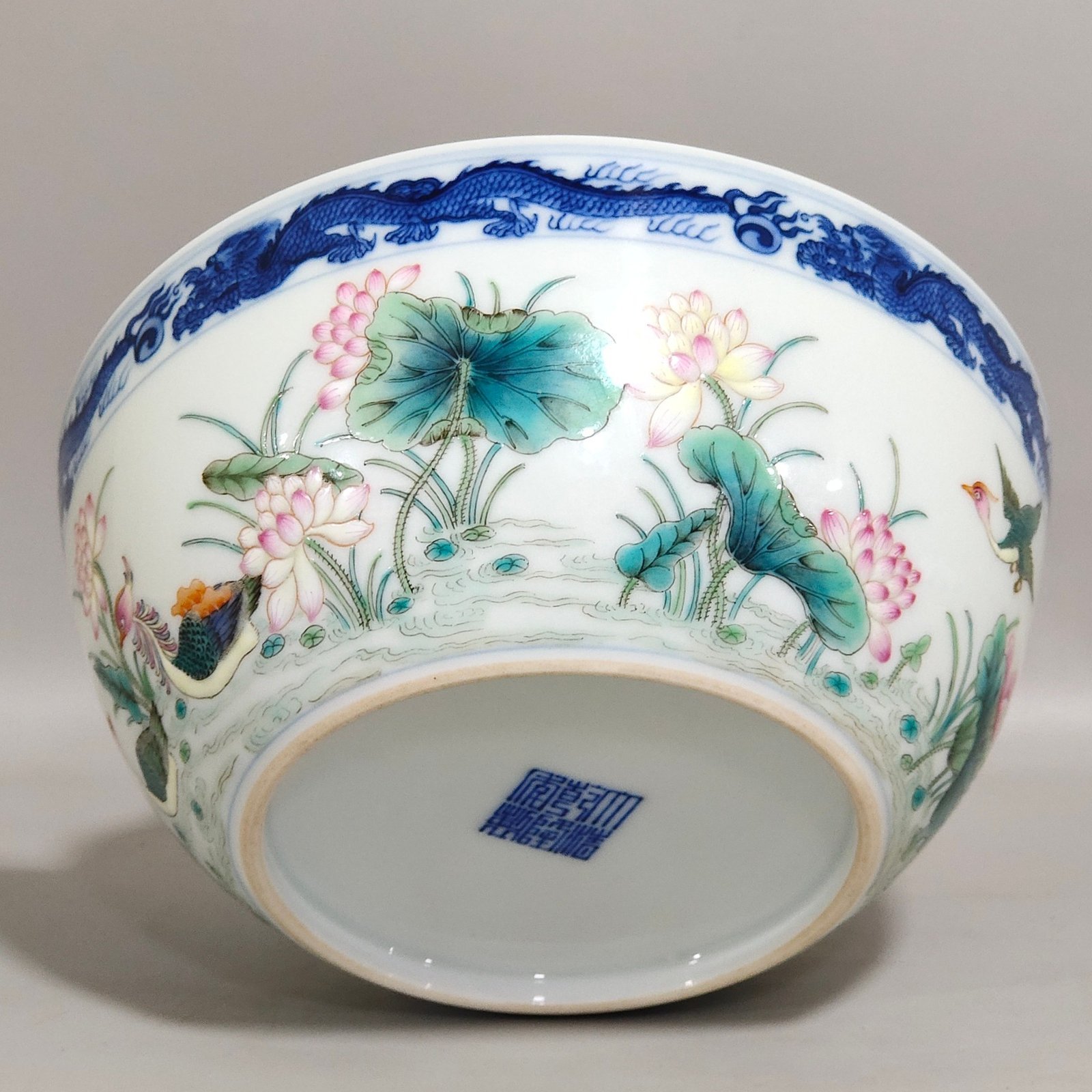 Qing Dynasty Qianlong blue and white dragon-patterned lotus bowl with mandarin ducks