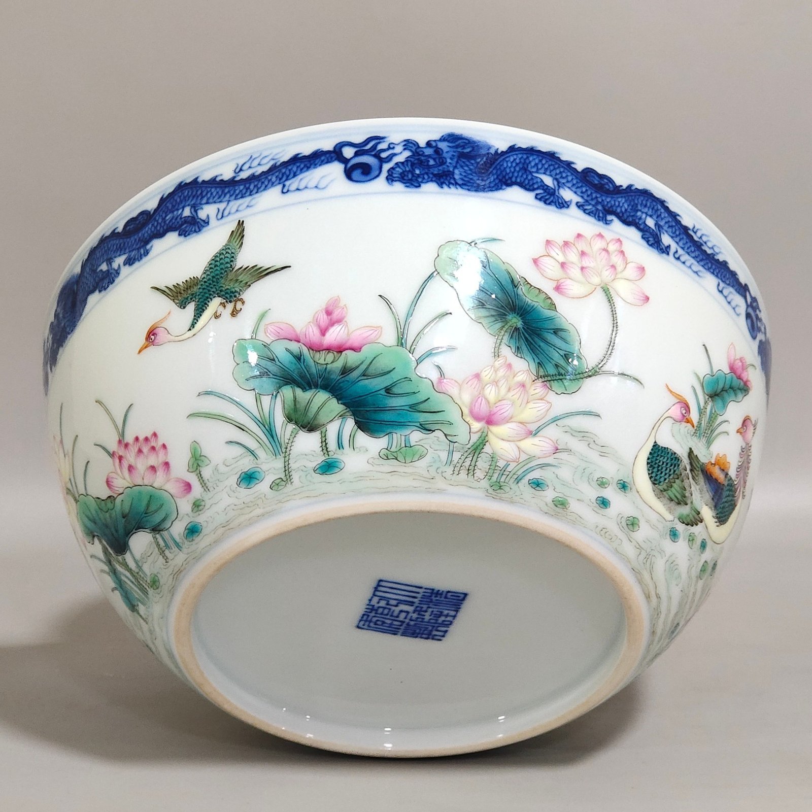 Qing Dynasty Qianlong blue and white dragon-patterned lotus bowl with mandarin ducks