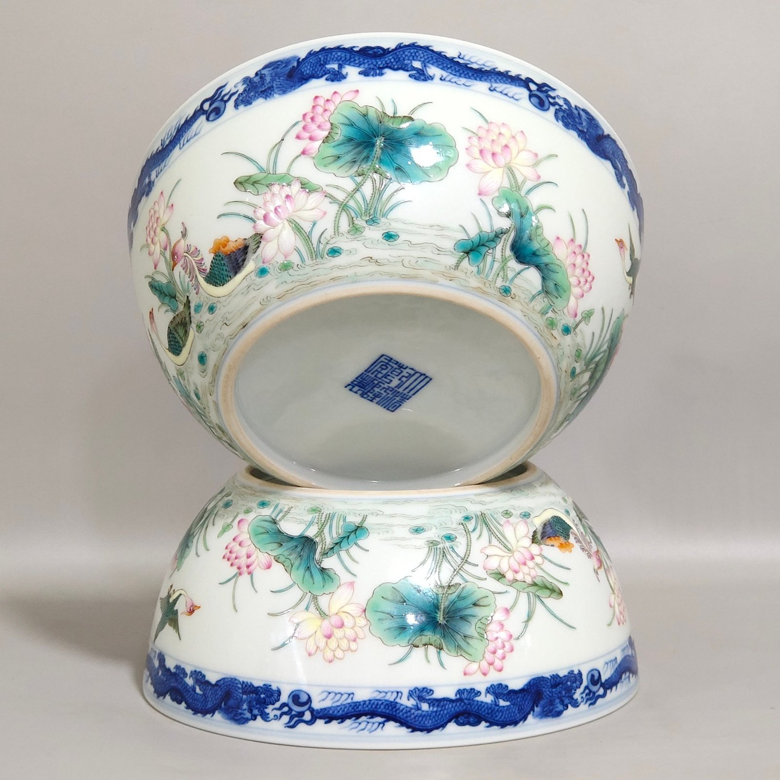 Qing Dynasty Qianlong blue and white dragon-patterned lotus bowl with mandarin ducks
