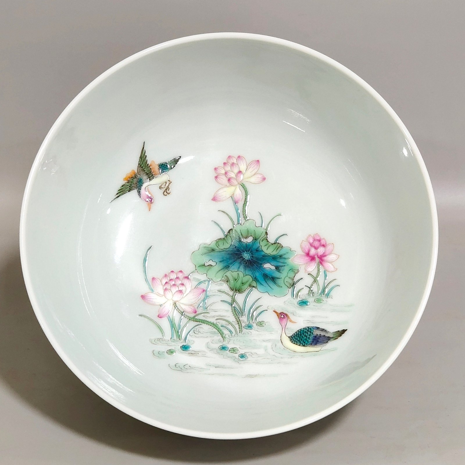 Qing Dynasty Qianlong blue and white dragon-patterned lotus bowl with mandarin ducks