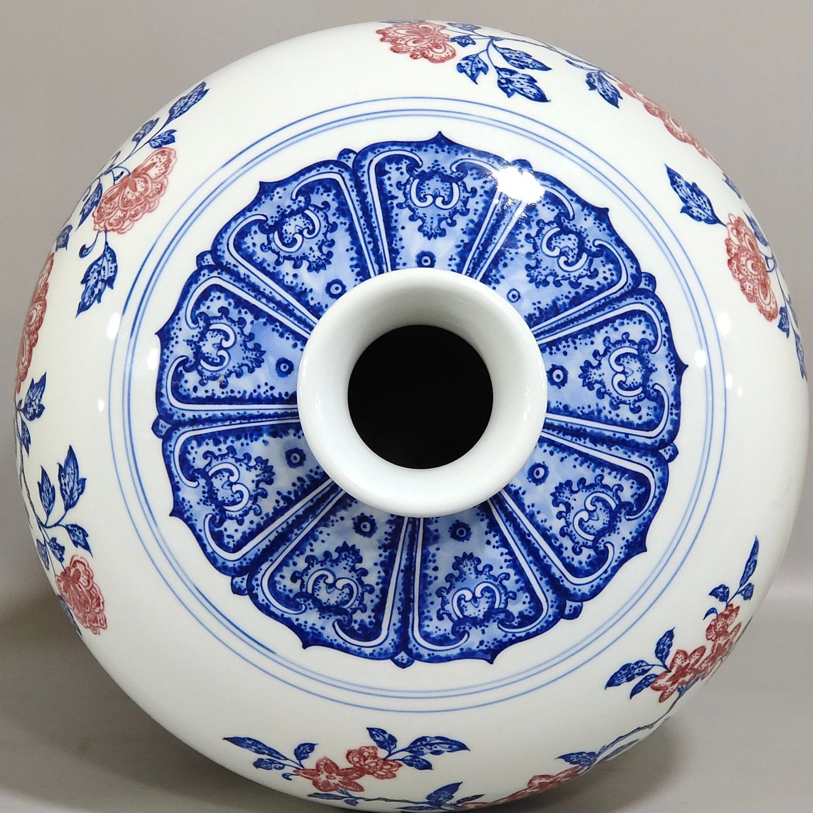 Qing Dynasty Qianlong celadon-glazed red three-plum vase