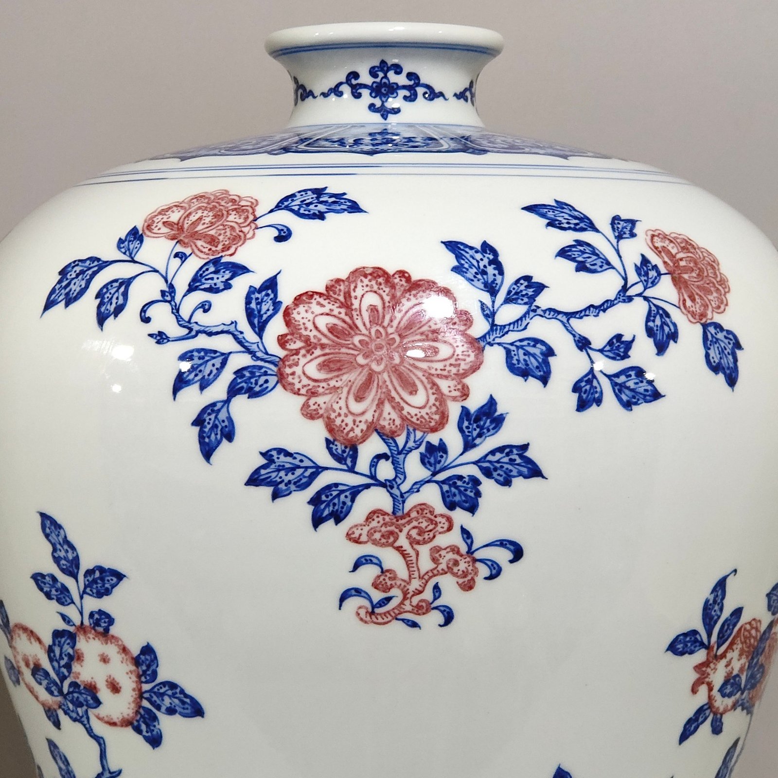 Qing Dynasty Qianlong celadon-glazed red three-plum vase