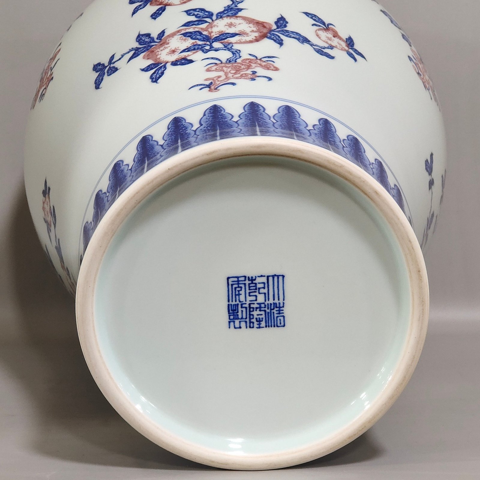 Qing Dynasty Qianlong celadon-glazed red three-plum vase