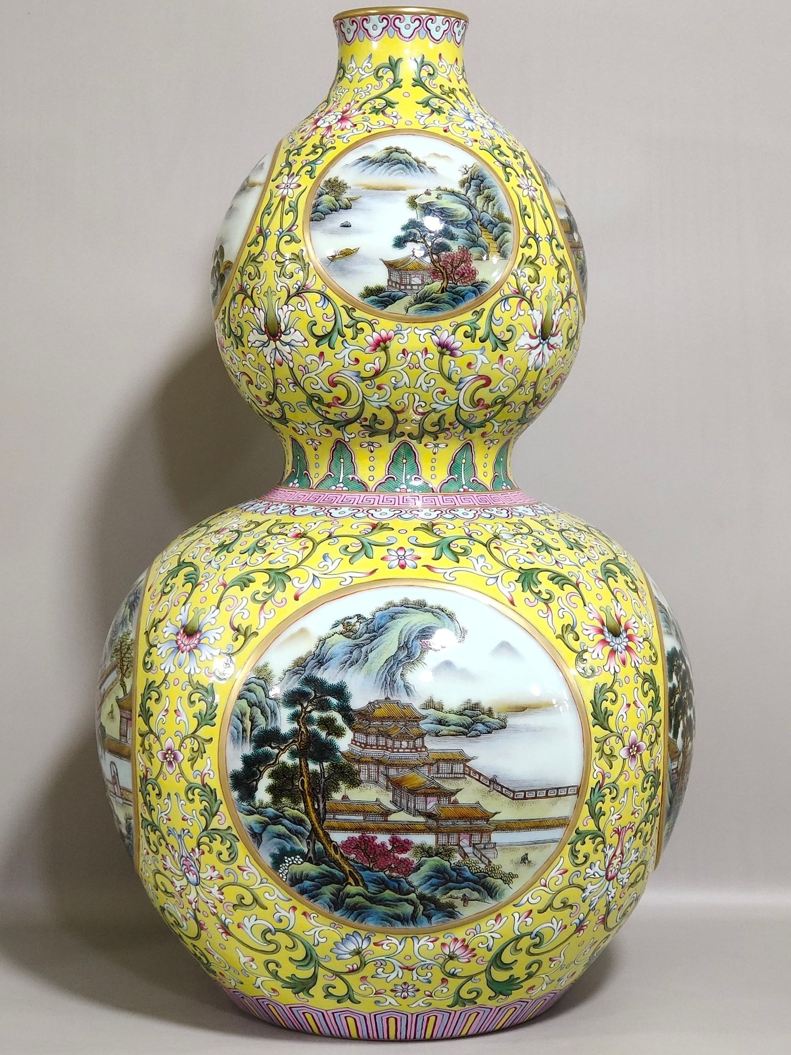 Qing Dynasty Qianlong yellow ground window landscape attic gourd vase