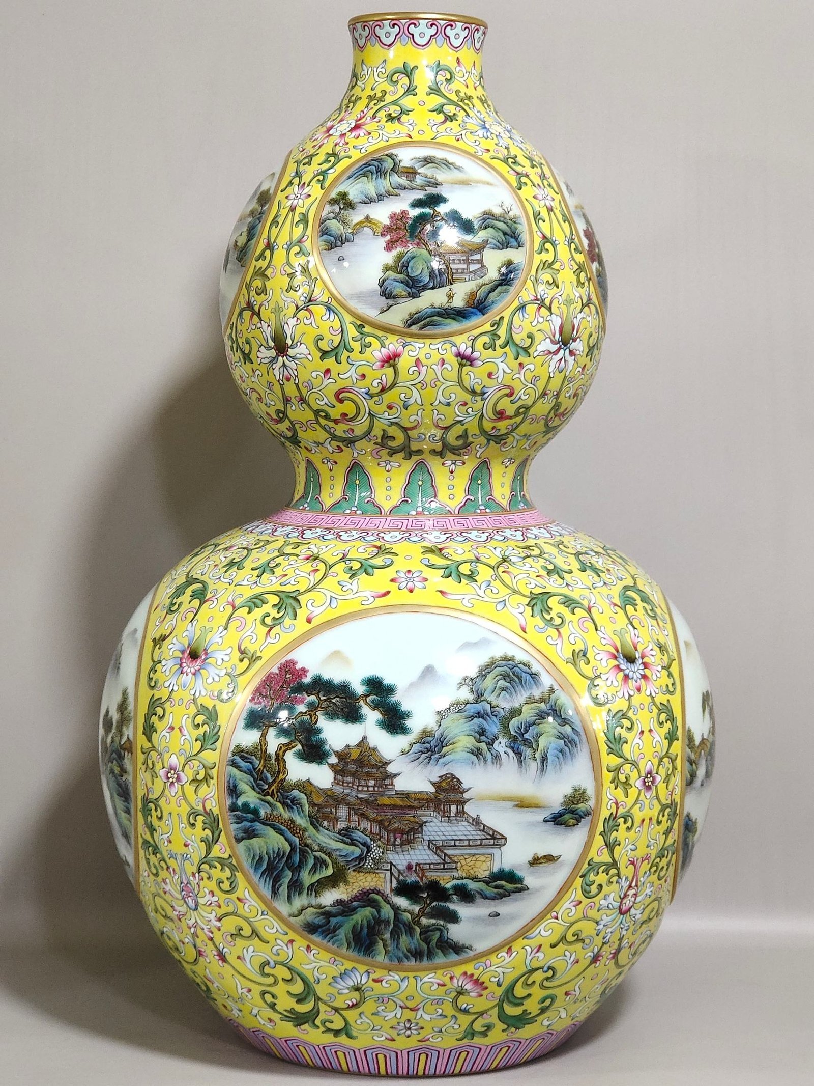 Qing Dynasty Qianlong yellow ground window landscape attic gourd vase