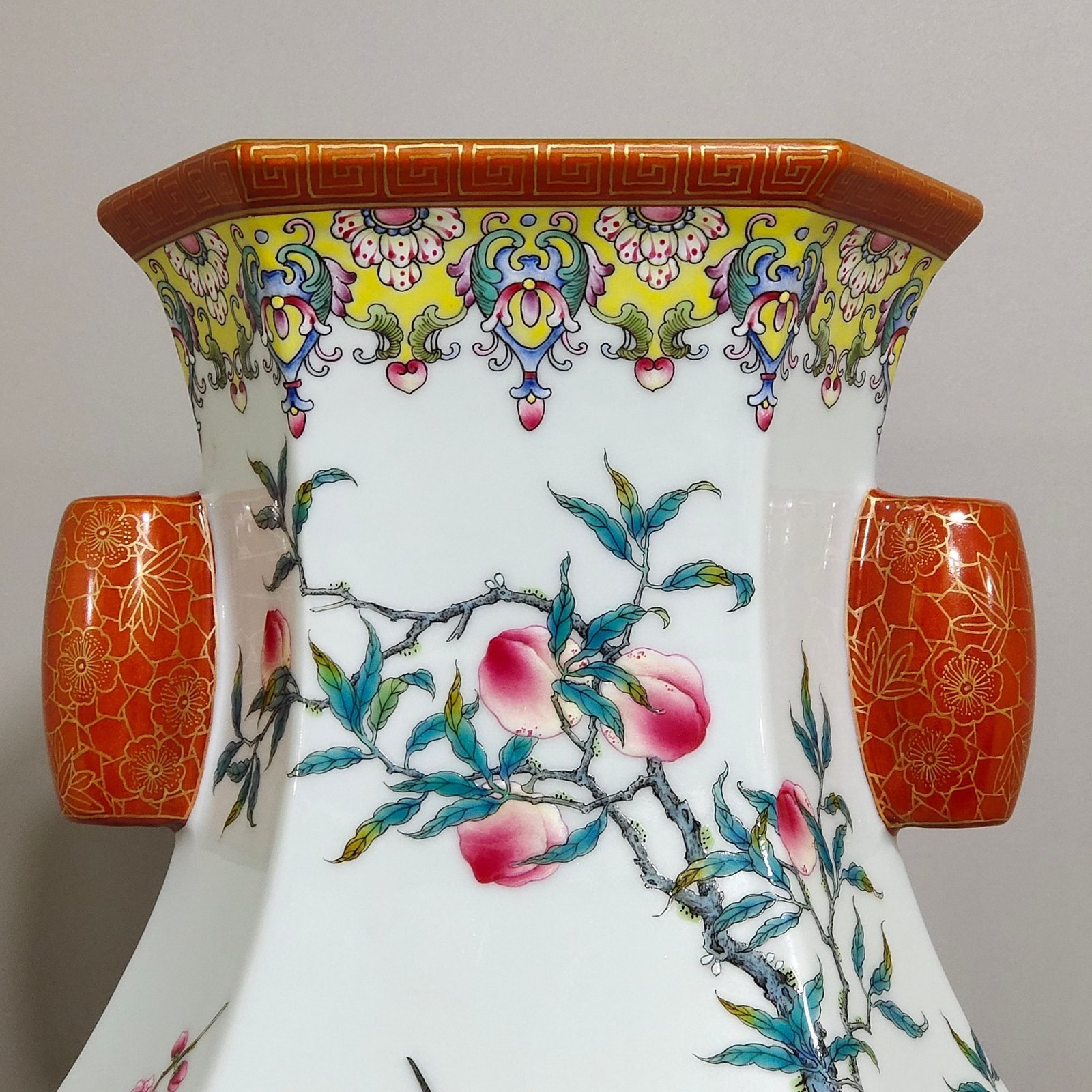 Qing Dynasty Qianlong yellow ground border plum peach congratulations six-sided amphora
