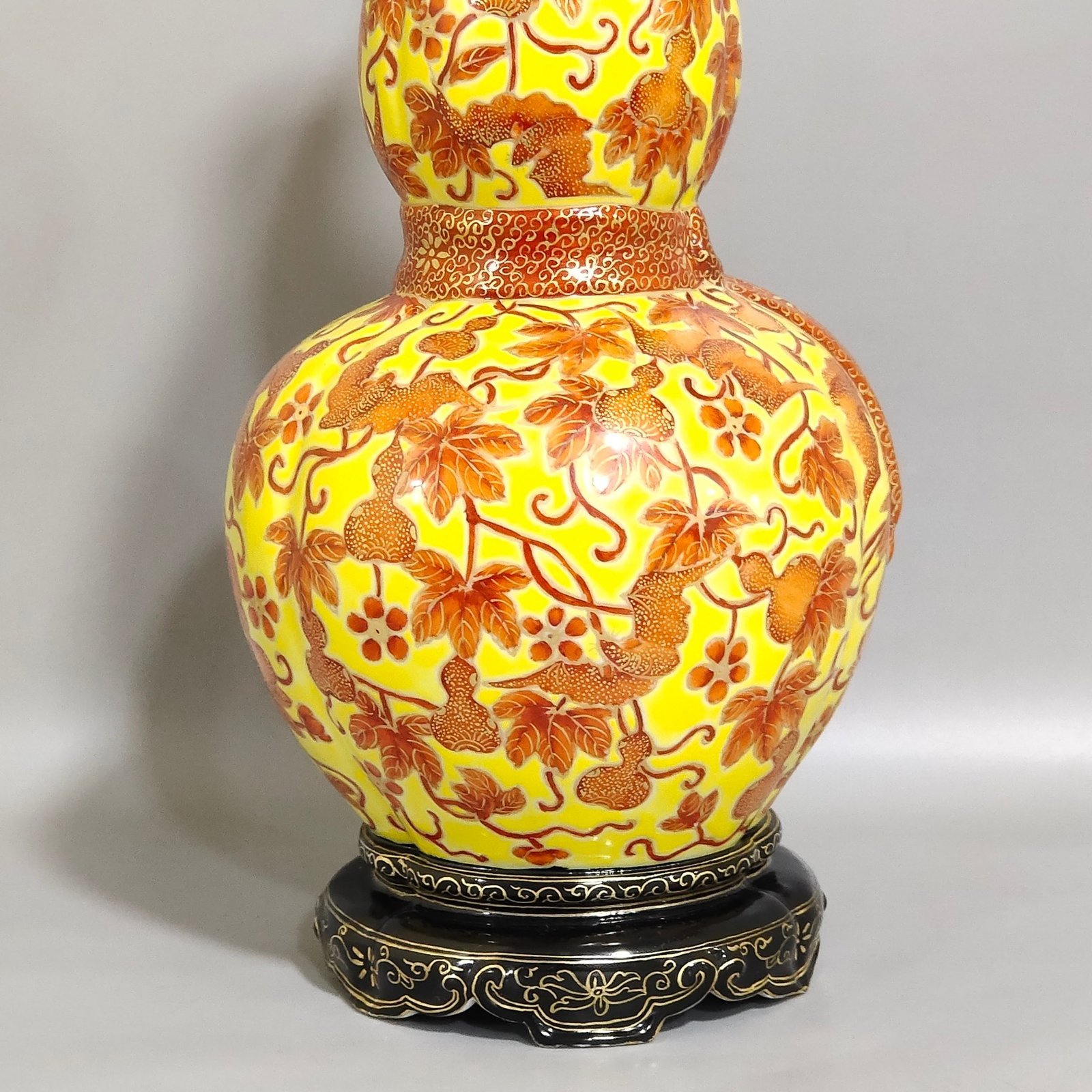 Qing Dynasty Qianlong yellow glaze painted gold-plated gourd vase