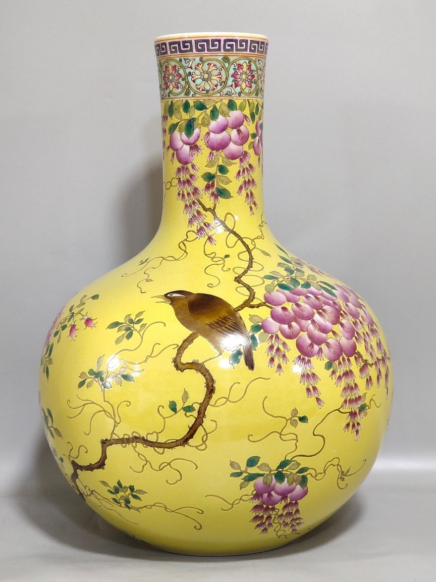 Qing Dynasty Qianlong yellow glaze flower and bird celestial vase