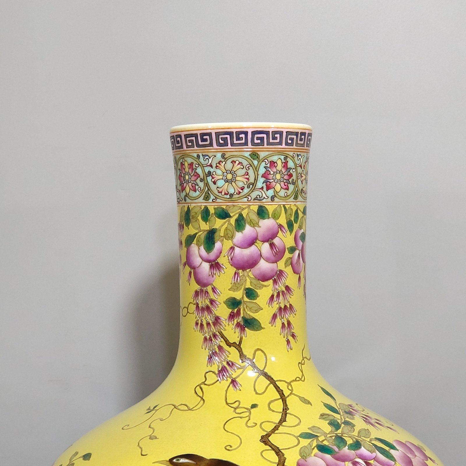 Qing Dynasty Qianlong yellow glaze flower and bird celestial vase