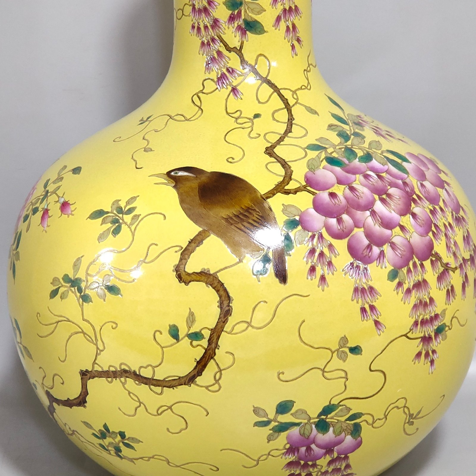 Qing Dynasty Qianlong yellow glaze flower and bird celestial vase