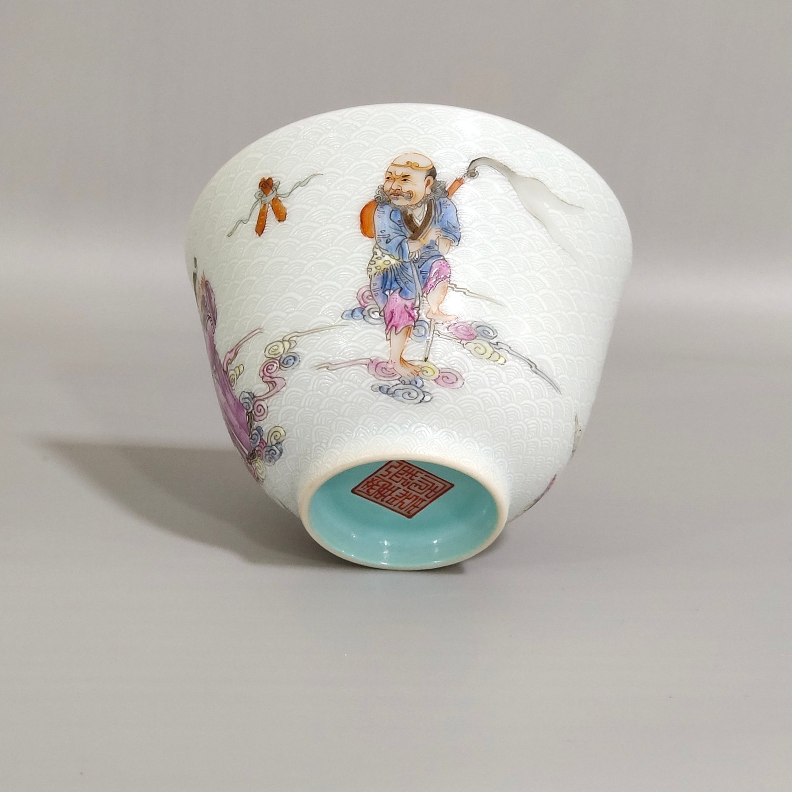 Qing Dynasty Jiaqing carvings with sea water pattern and Eight Immortals crossing the sea cup