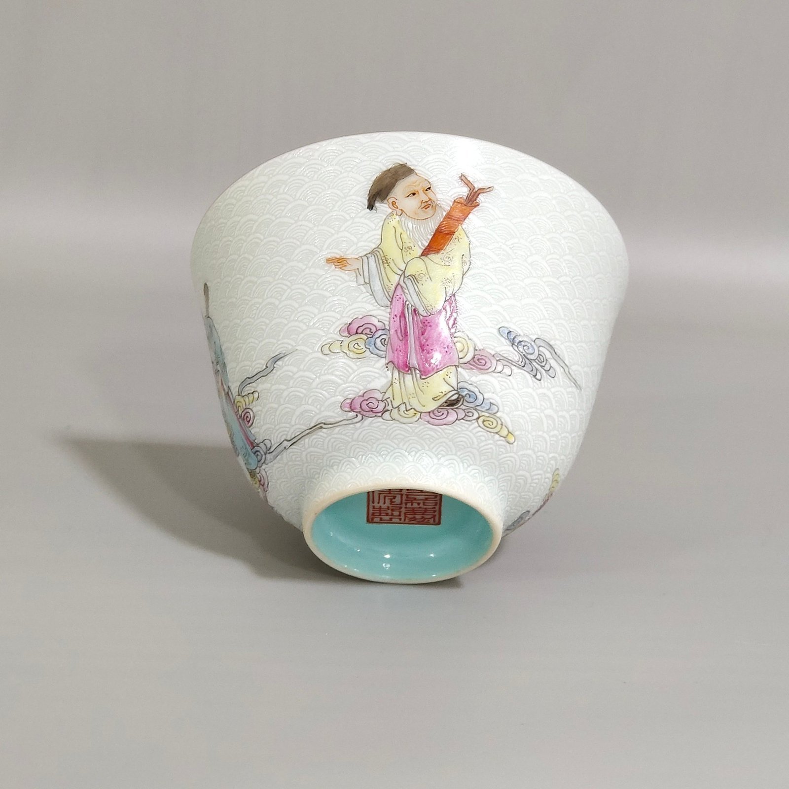 Qing Dynasty Jiaqing carvings with sea water pattern and Eight Immortals crossing the sea cup