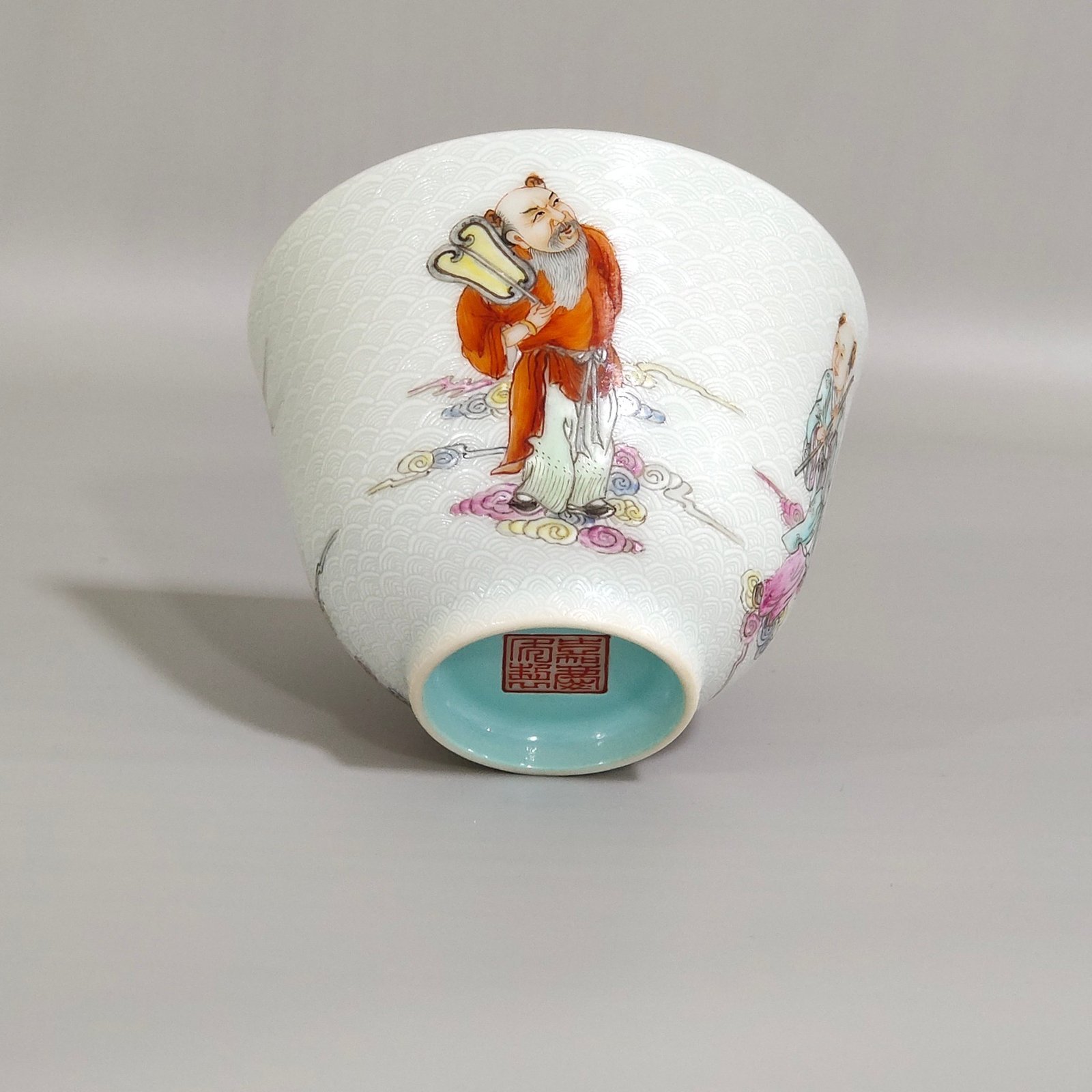 Qing Dynasty Jiaqing carvings with sea water pattern and Eight Immortals crossing the sea cup