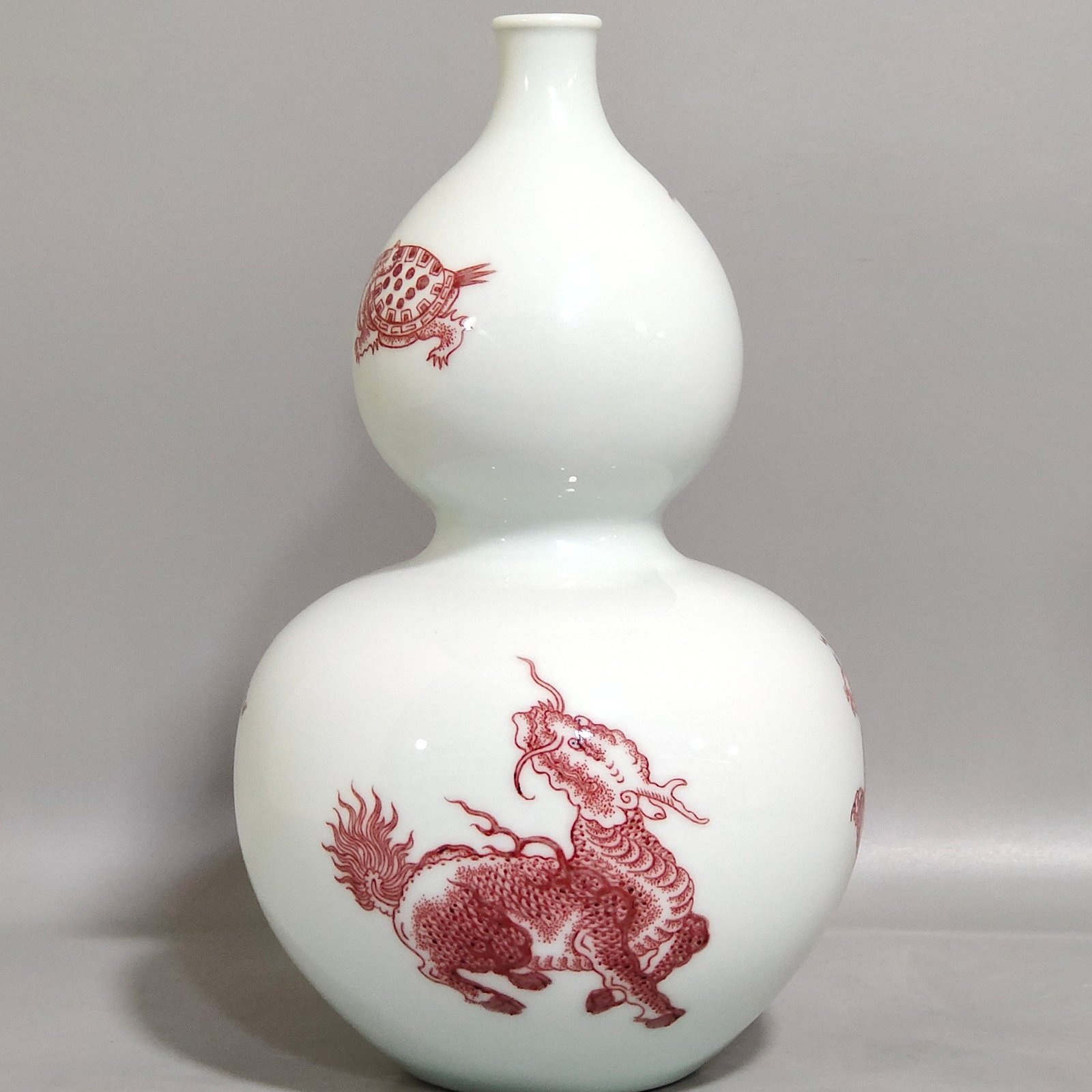 Qing Dynasty Kangxi underglaze red animal gourd bottle
