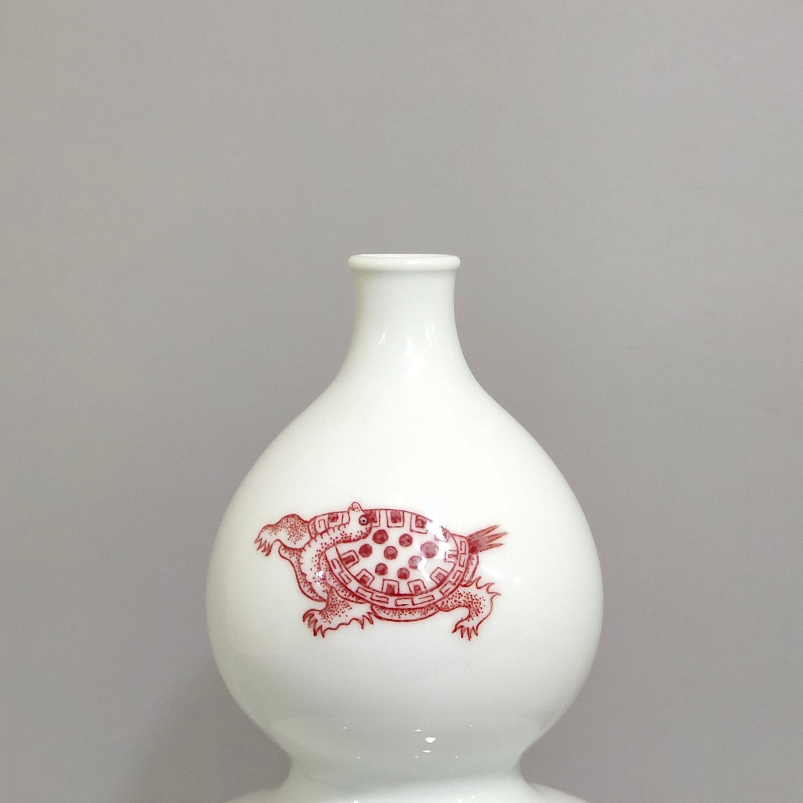 Qing Dynasty Kangxi underglaze red animal gourd bottle