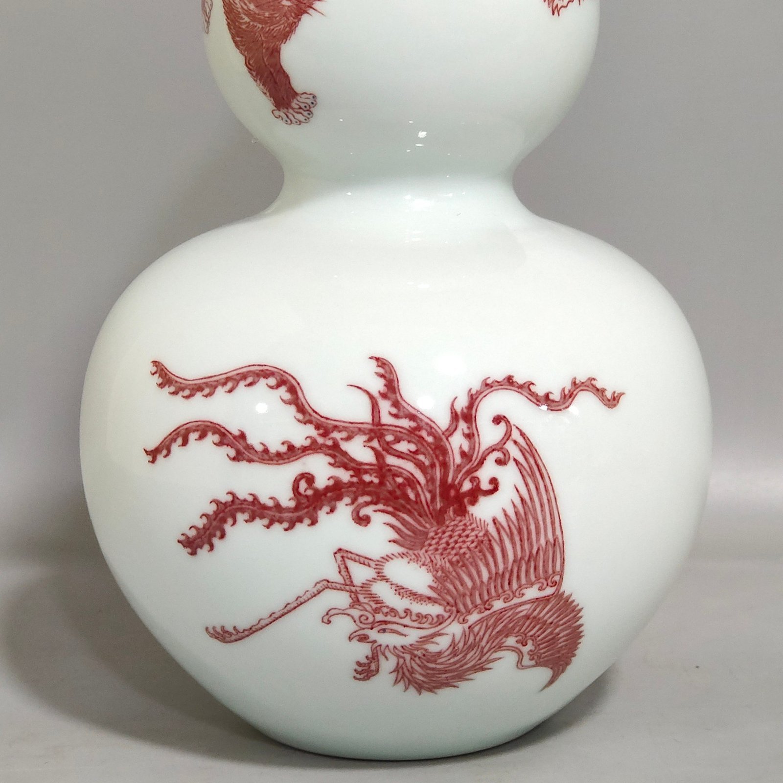 Qing Dynasty Kangxi underglaze red animal gourd bottle