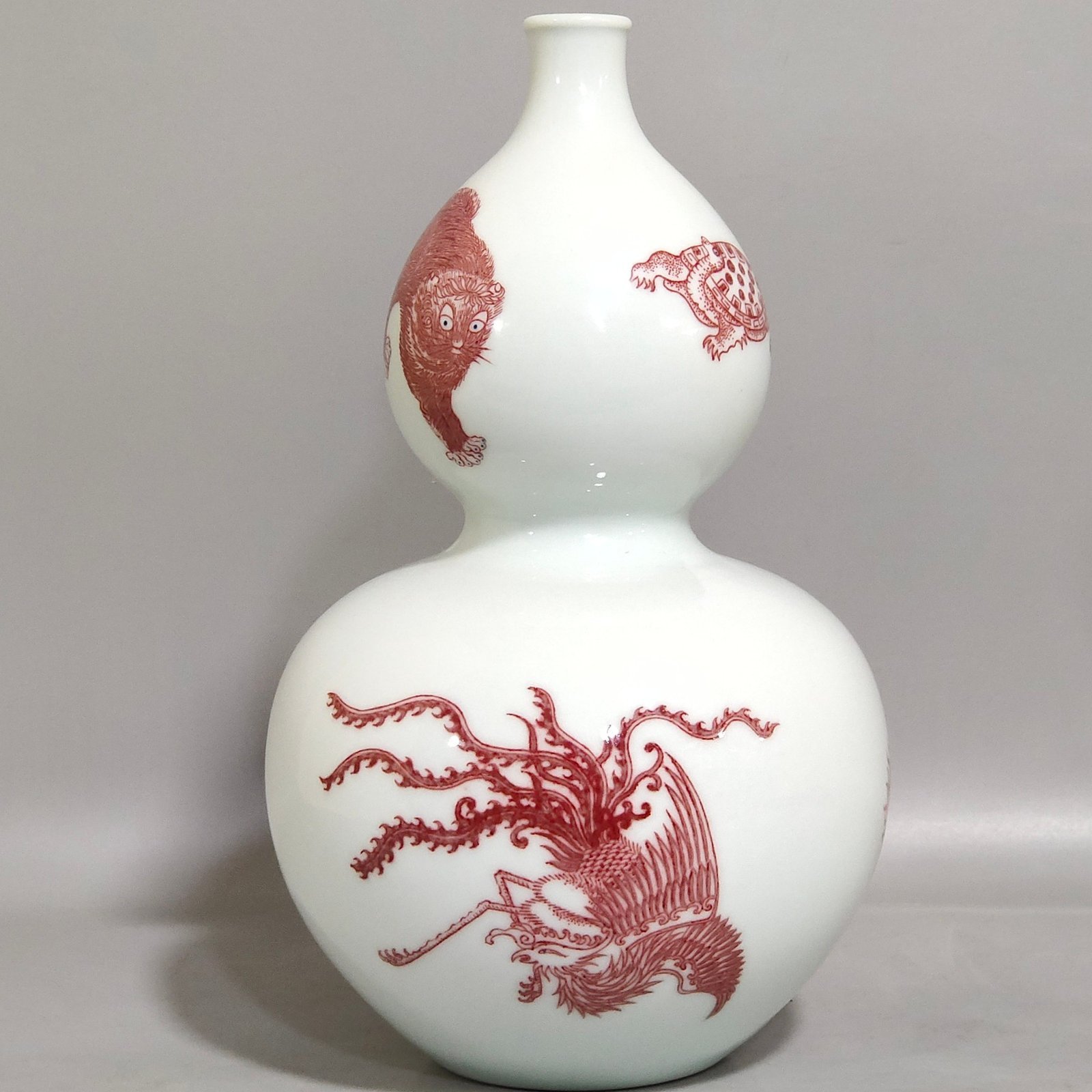 Qing Dynasty Kangxi underglaze red animal gourd bottle