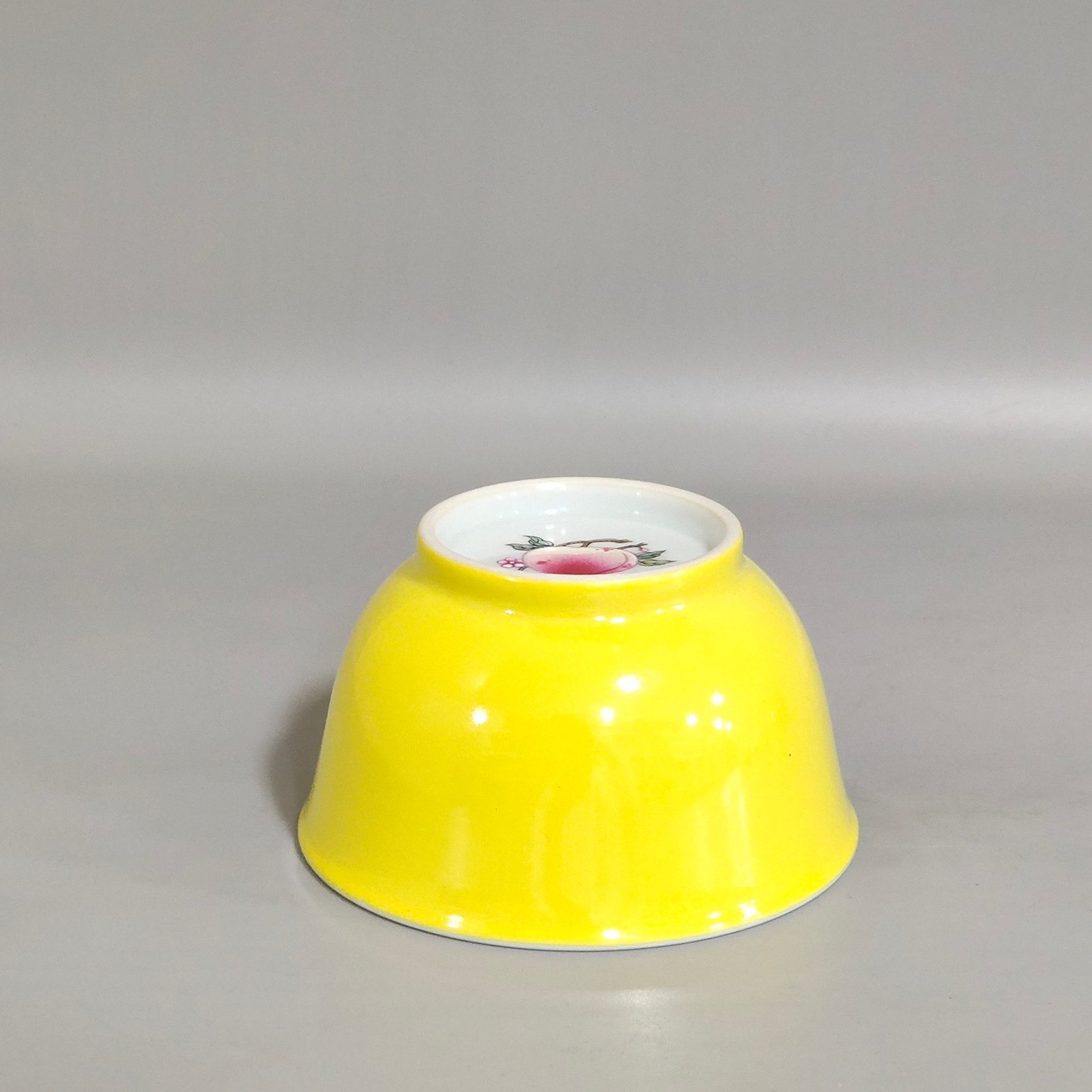 Qing Dynasty Kangxi lemon yellow glaze painted peach cup
