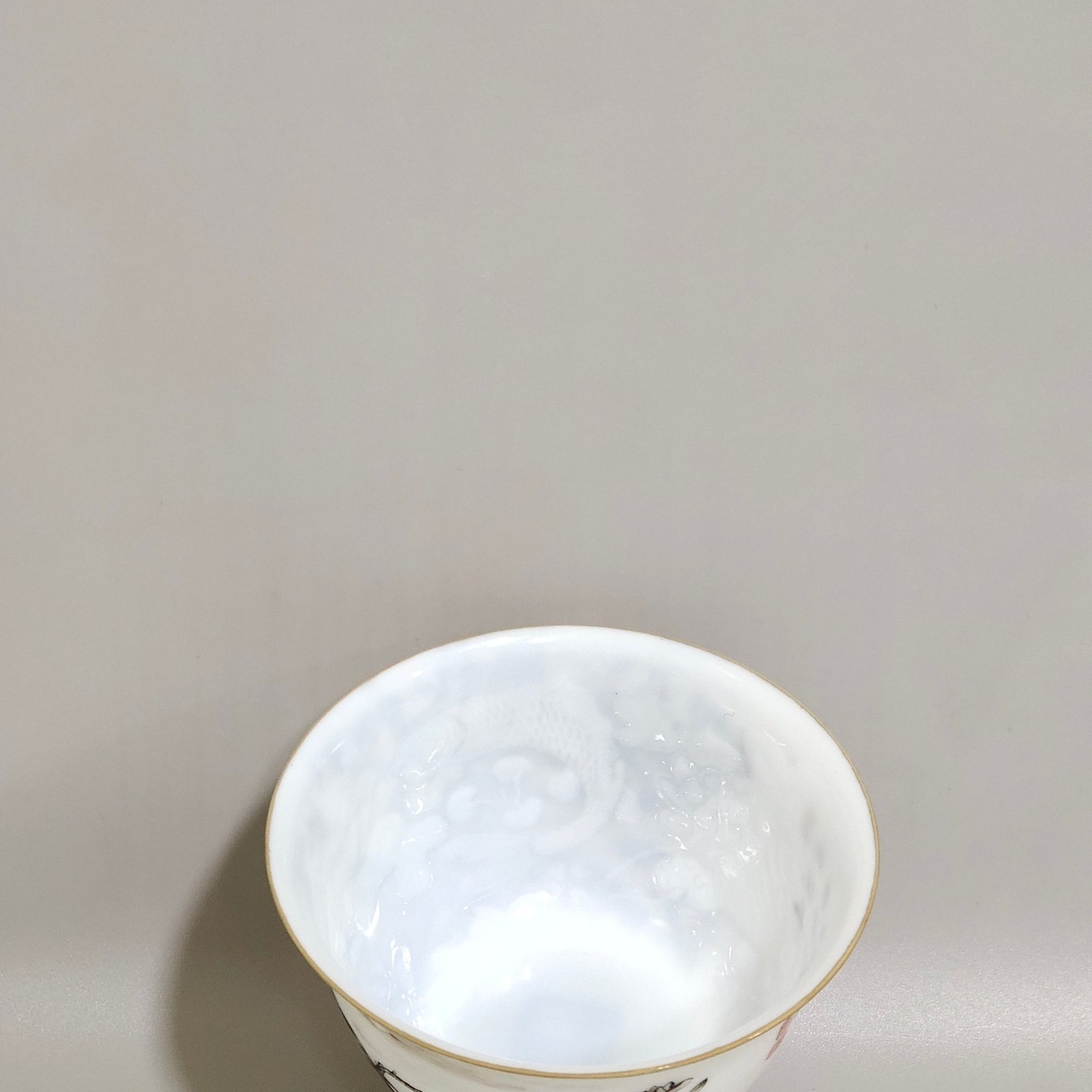 Qing Dynasty Yongzheng ink color flower and bird poem with hidden engraved fish and algae cup