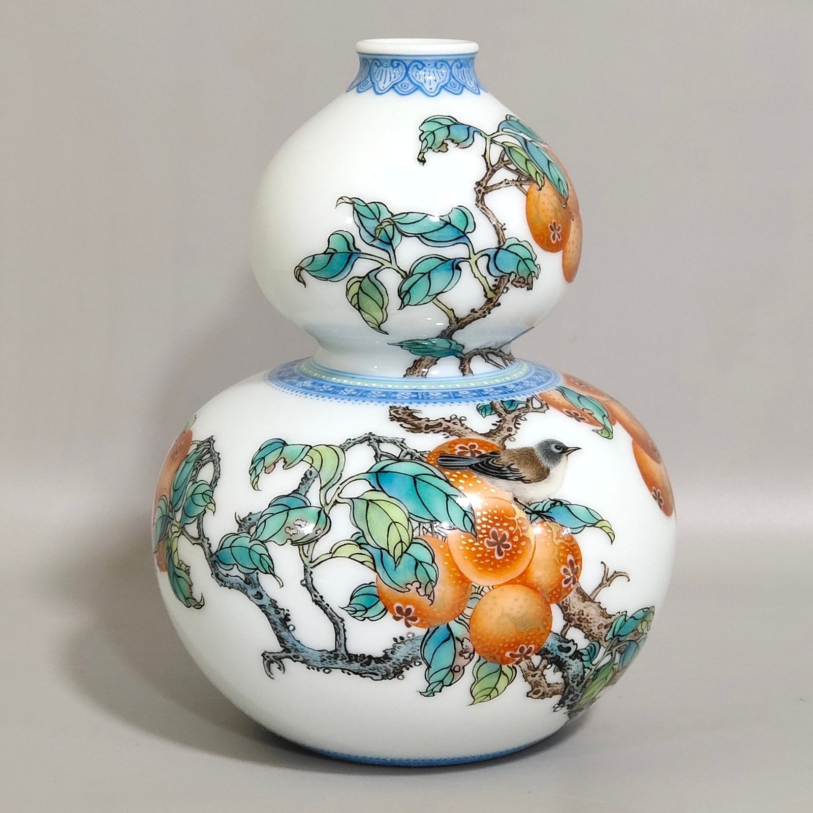 Qing Dynasty Yongzheng A green edged gourd vase with persimmons flowers and birds