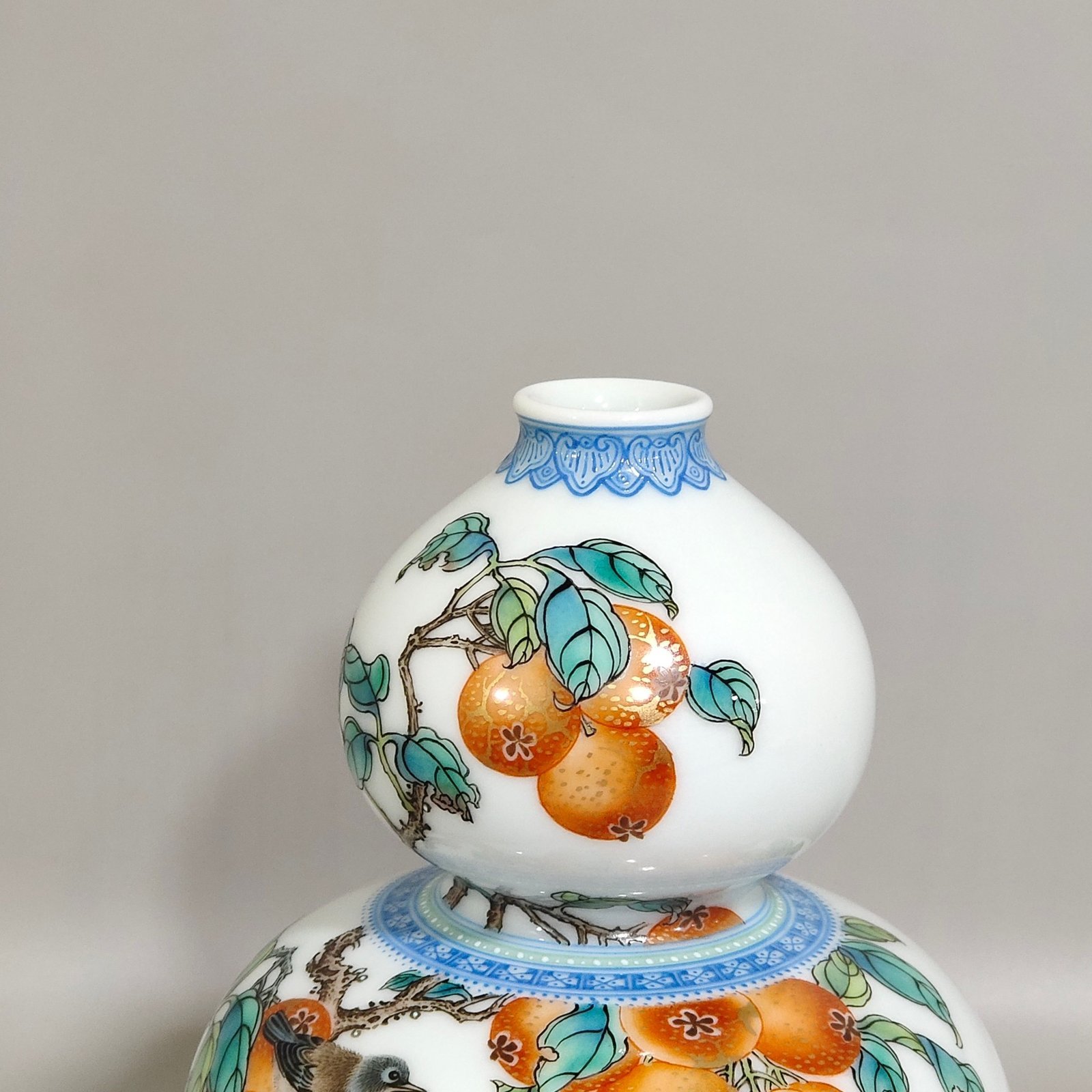 Qing Dynasty Yongzheng A green edged gourd vase with persimmons flowers and birds