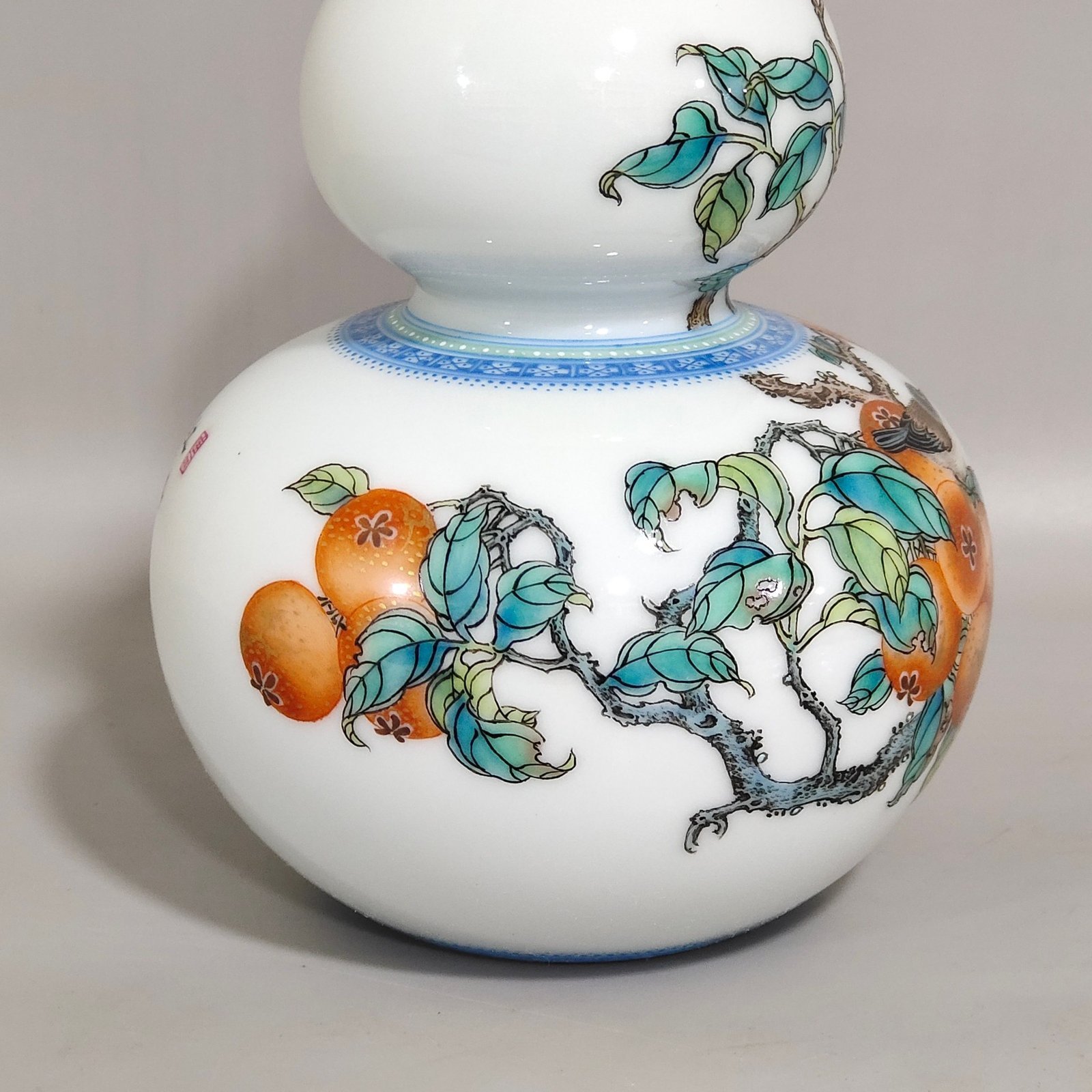 Qing Dynasty Yongzheng A green edged gourd vase with persimmons flowers and birds