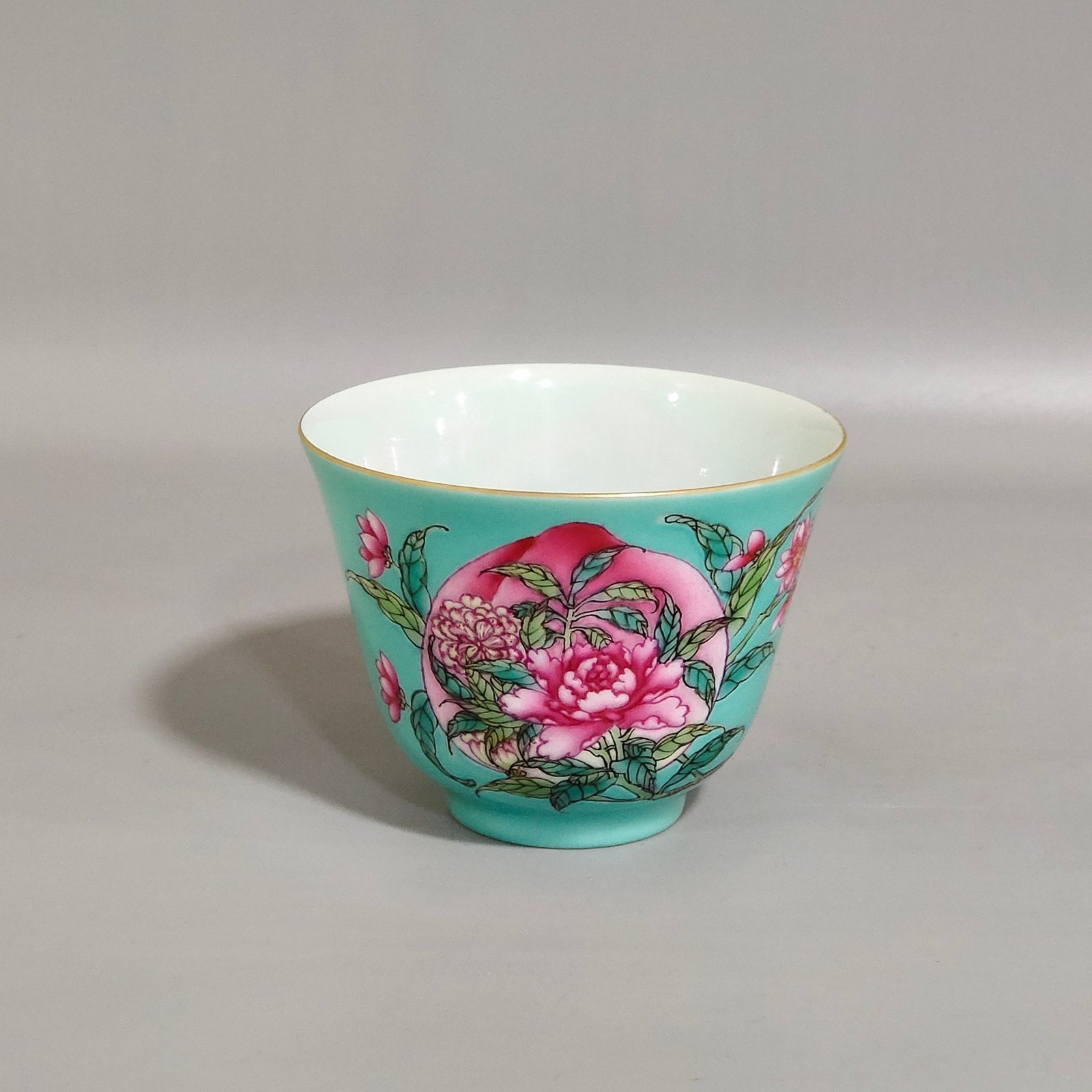 Qing Dynasty Yongzheng turquoise green longevity peach and peony tea set cup