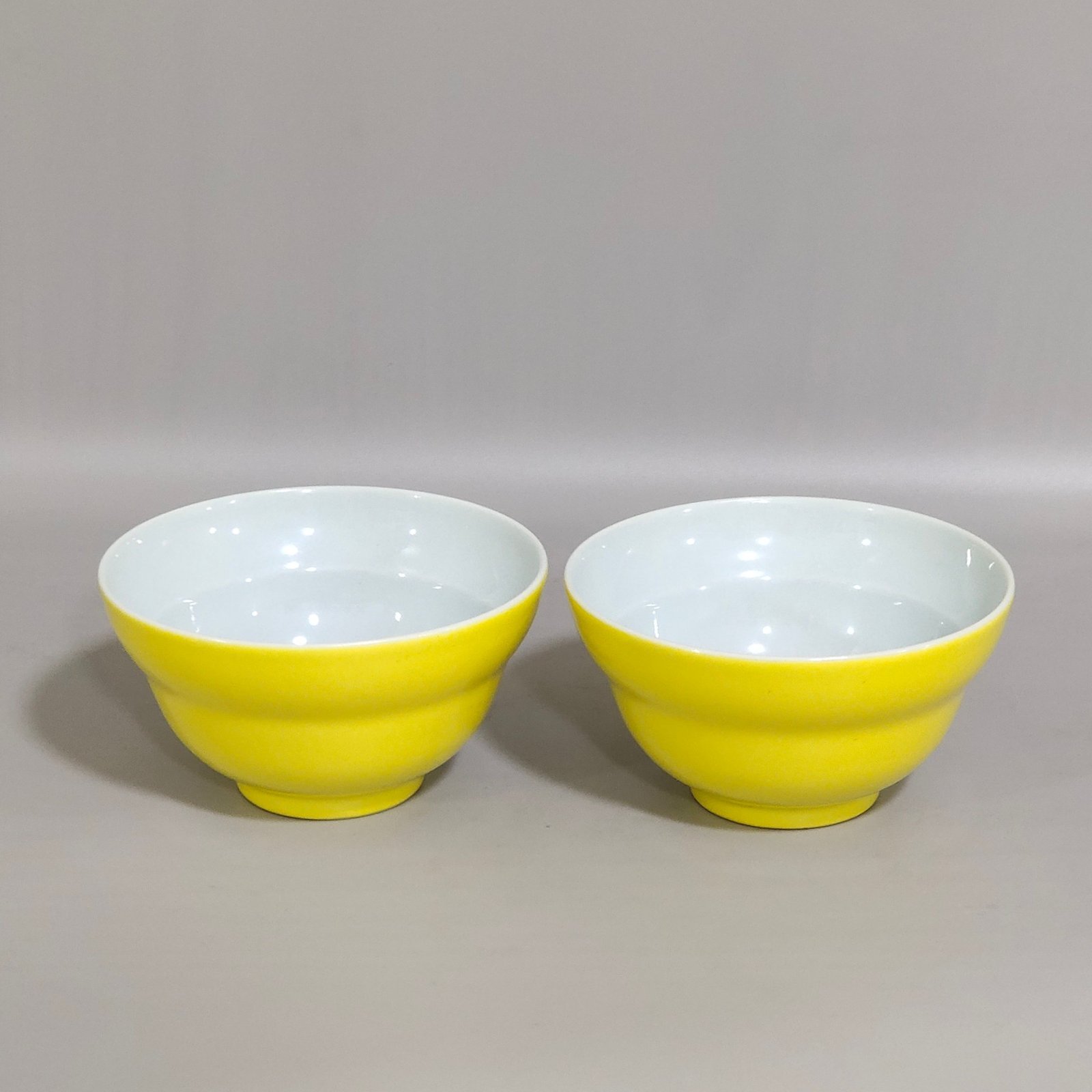 Qing Dynasty Yongzheng lemon yellow glaze folding cup with interior painting