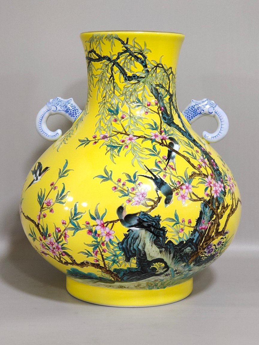 Qing Dynasty Yongzheng lemon yellow glazed willow swallow elephant ear vase