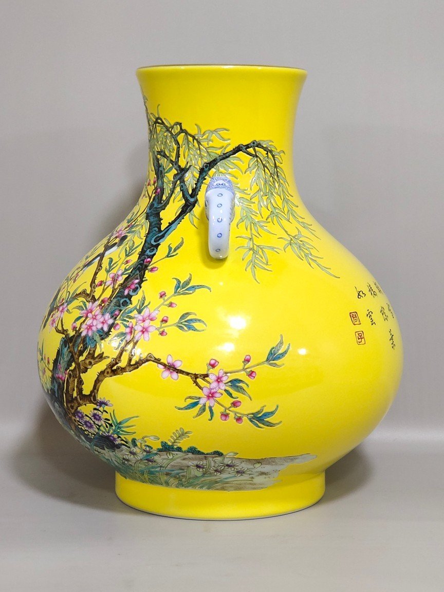 Qing Dynasty Yongzheng lemon yellow glazed willow swallow elephant ear vase