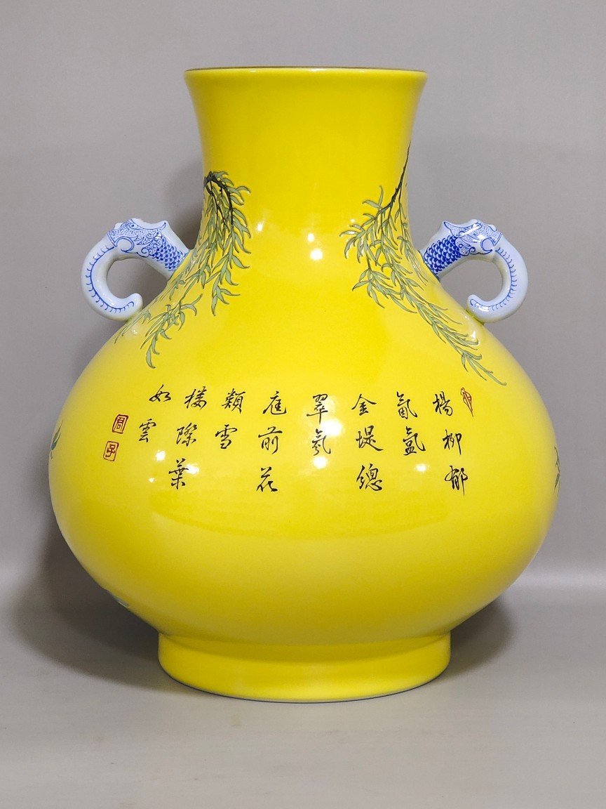 Qing Dynasty Yongzheng lemon yellow glazed willow swallow elephant ear vase