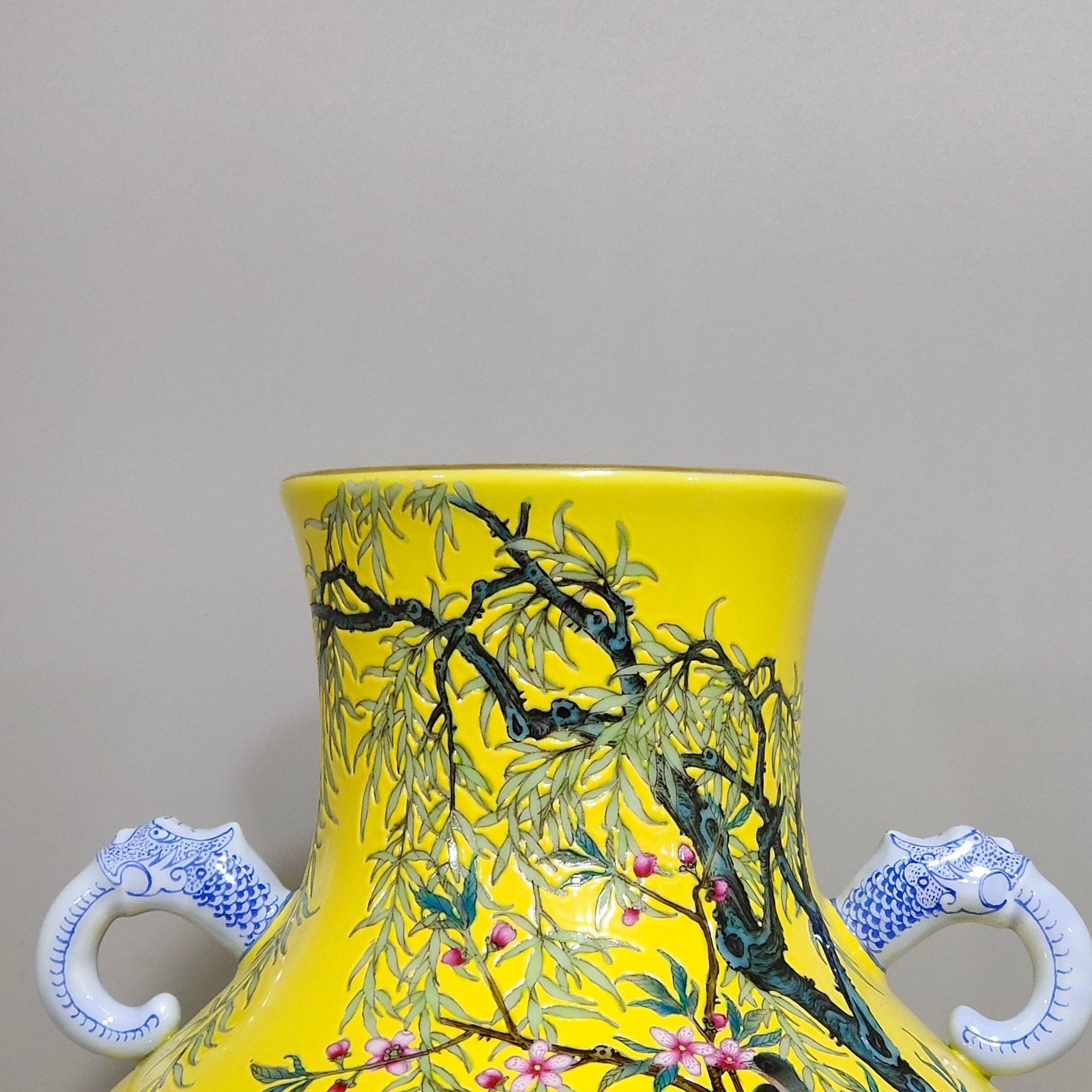 Qing Dynasty Yongzheng lemon yellow glazed willow swallow elephant ear vase