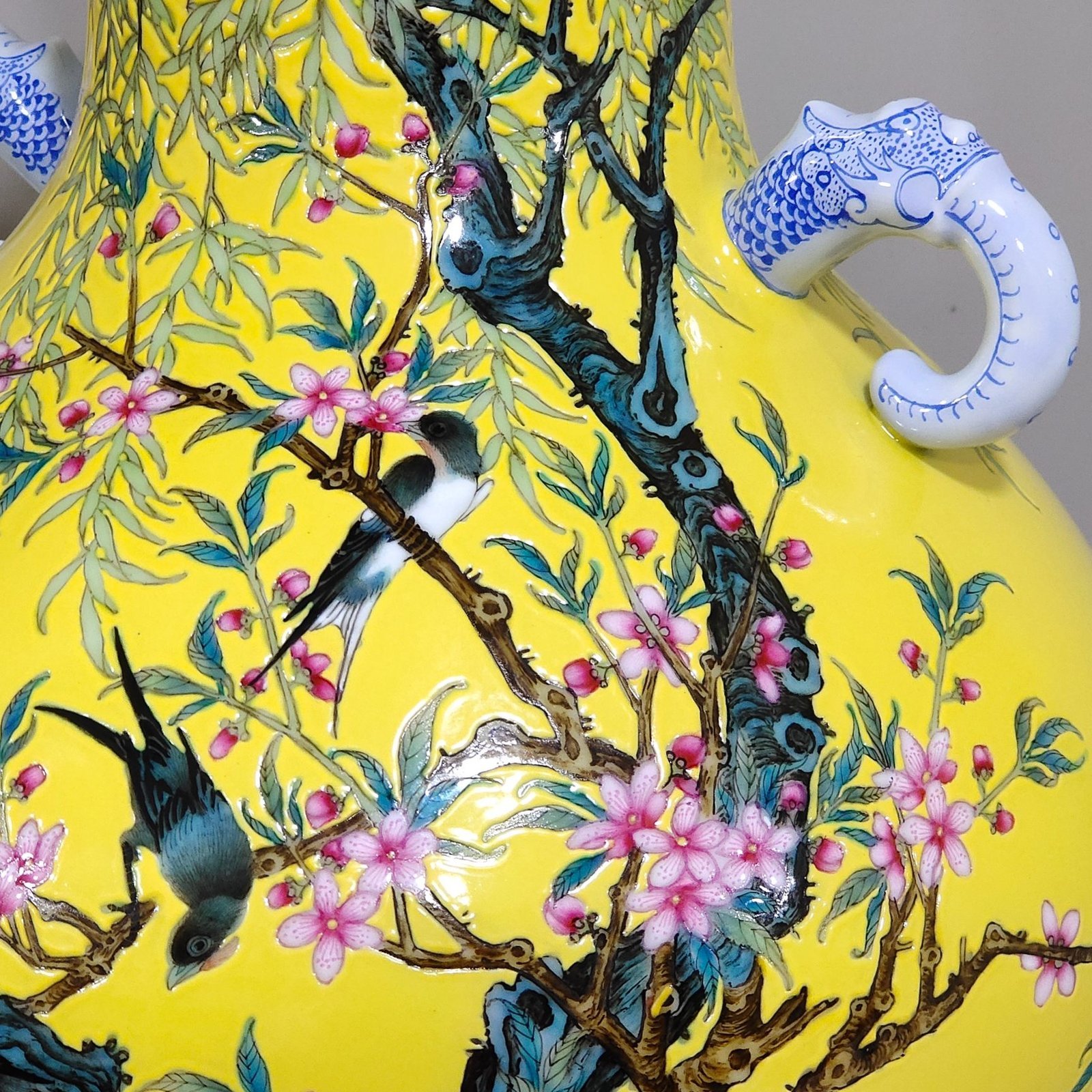 Qing Dynasty Yongzheng lemon yellow glazed willow swallow elephant ear vase
