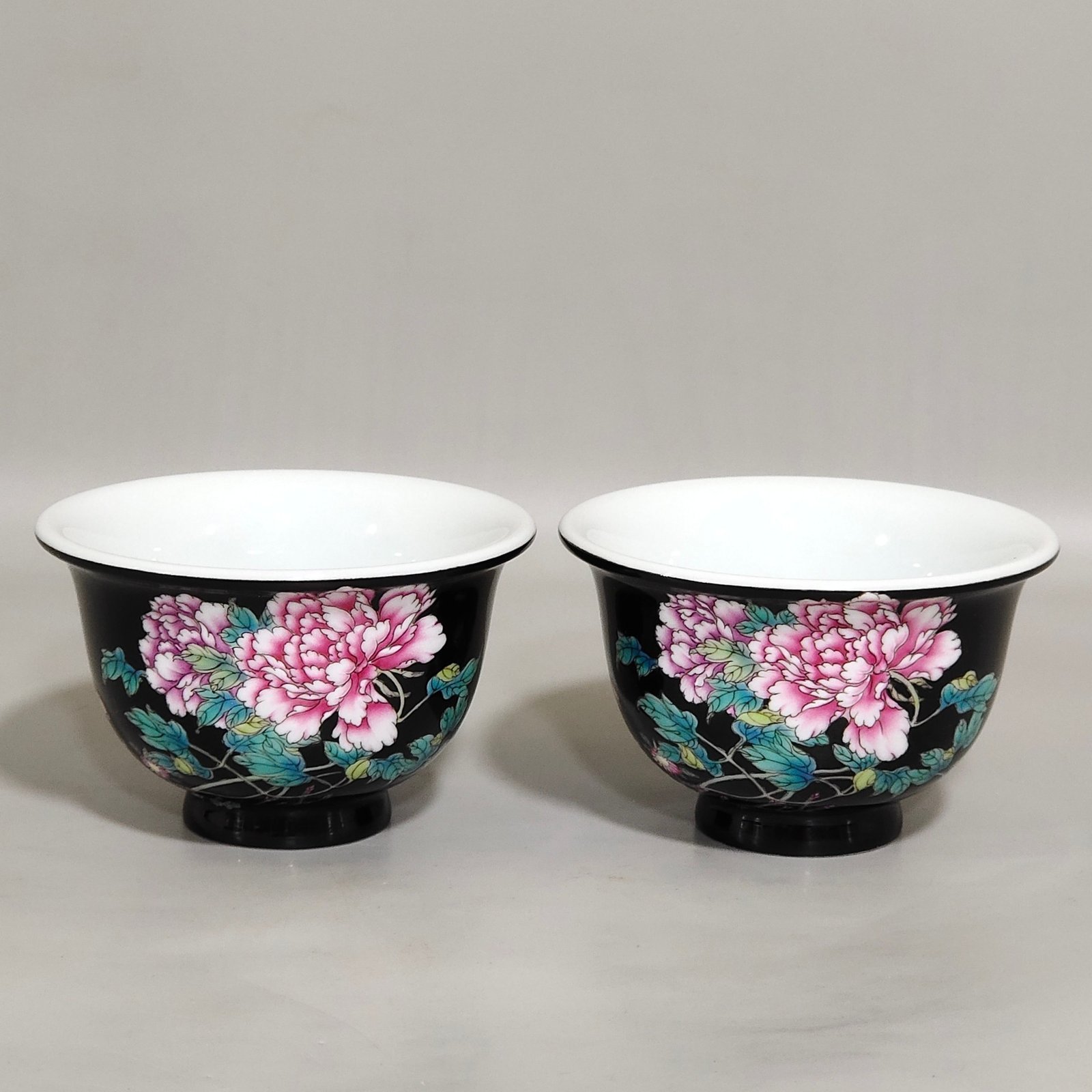 Qing Dynasty Yongzheng enamel black gold glaze peony flower poem cup