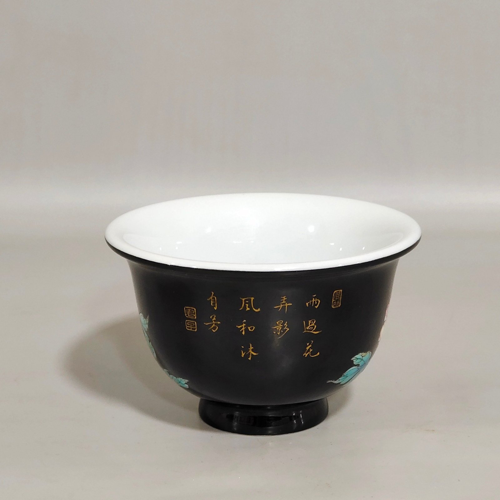 Qing Dynasty Yongzheng enamel black gold glaze peony flower poem cup