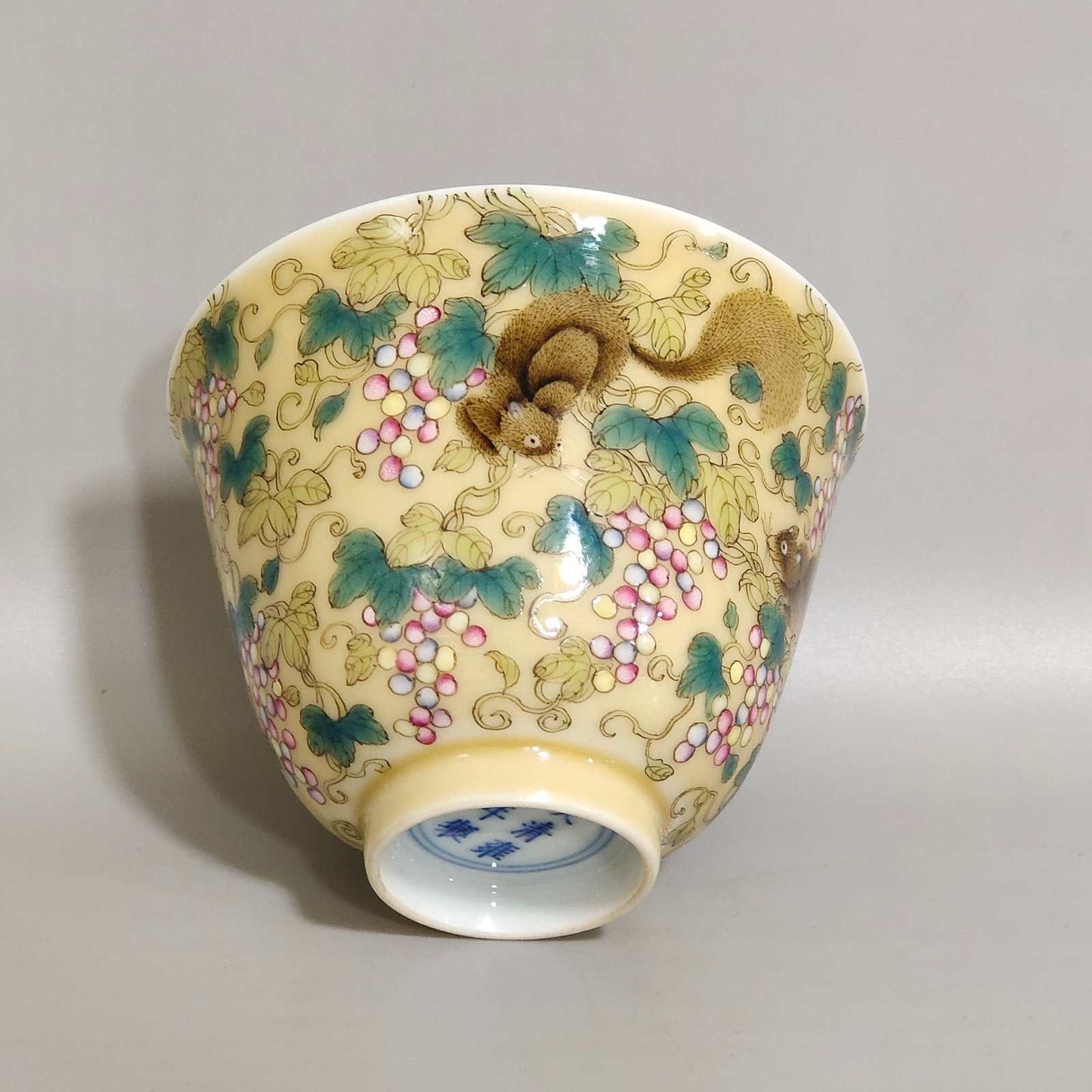 Qing Dynasty Yongzheng beige glazed squirrel grape cup
