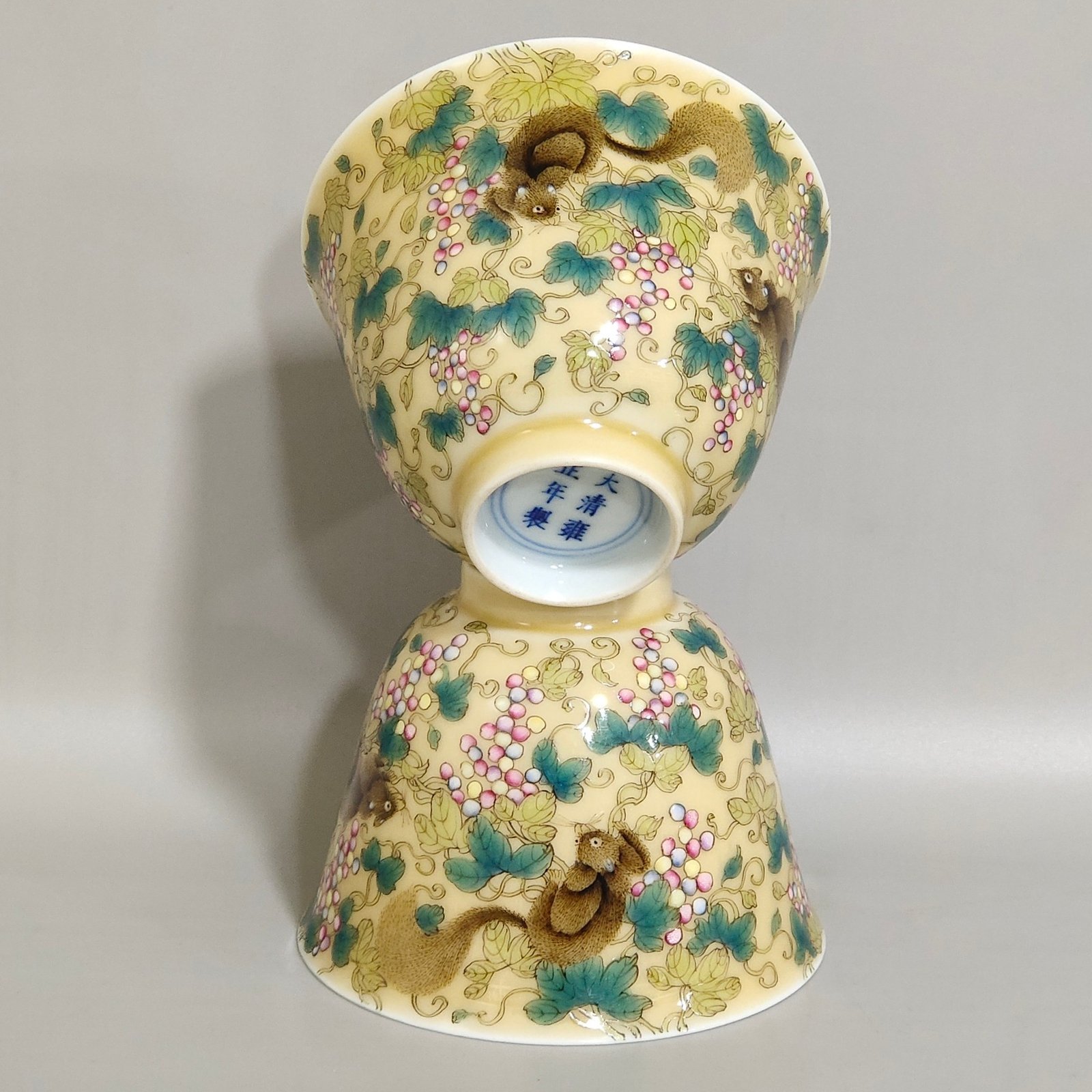 Qing Dynasty Yongzheng beige glazed squirrel grape cup