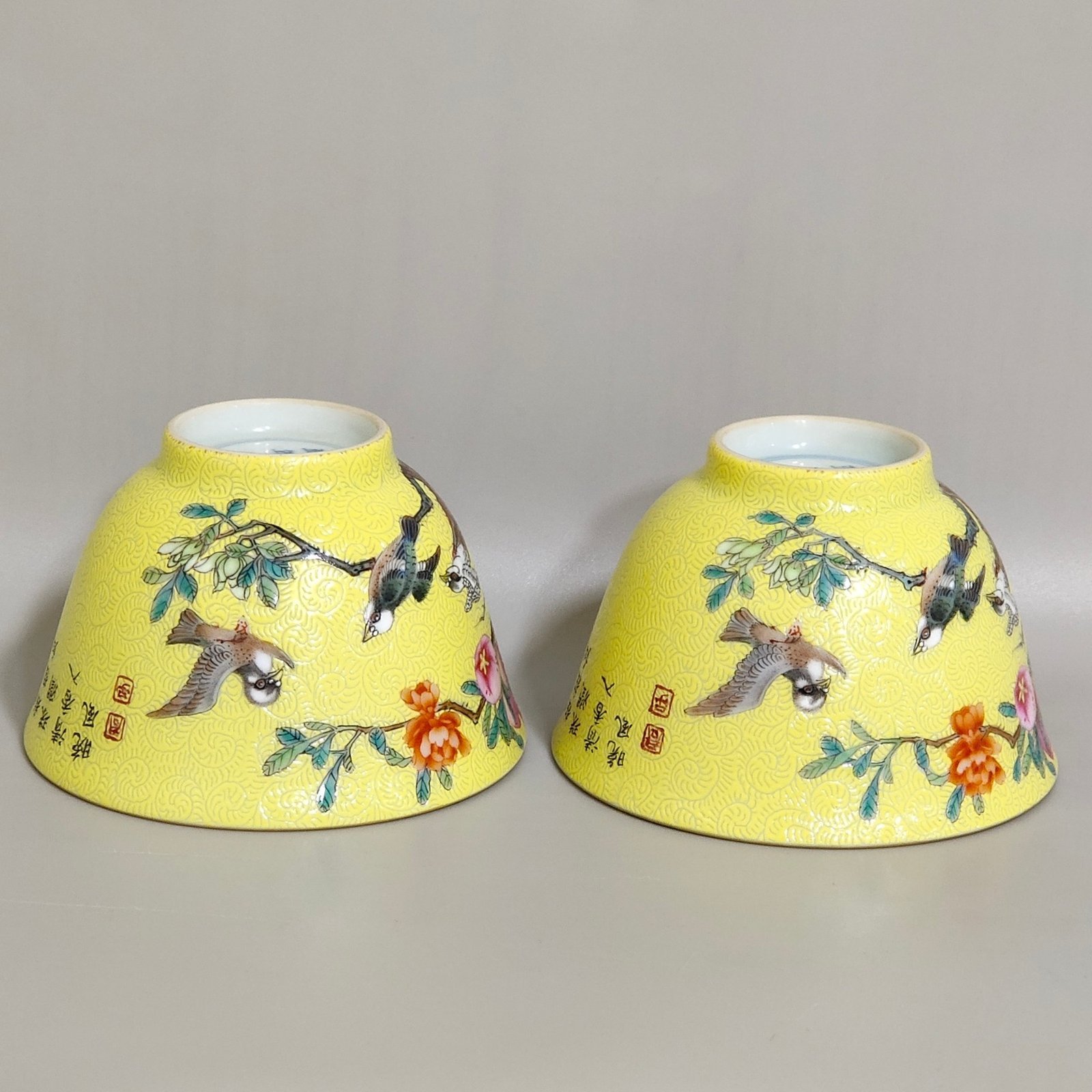 Qing Dynasty Yongzheng pink pomegranate flower and bird inscribed cup