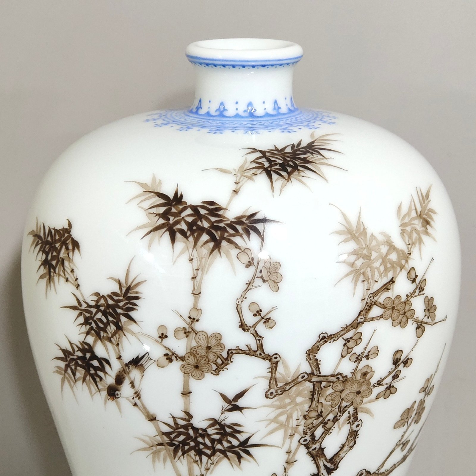 Qing Dynasty Yongzheng green edged ink colored plum vase with plum and bamboo