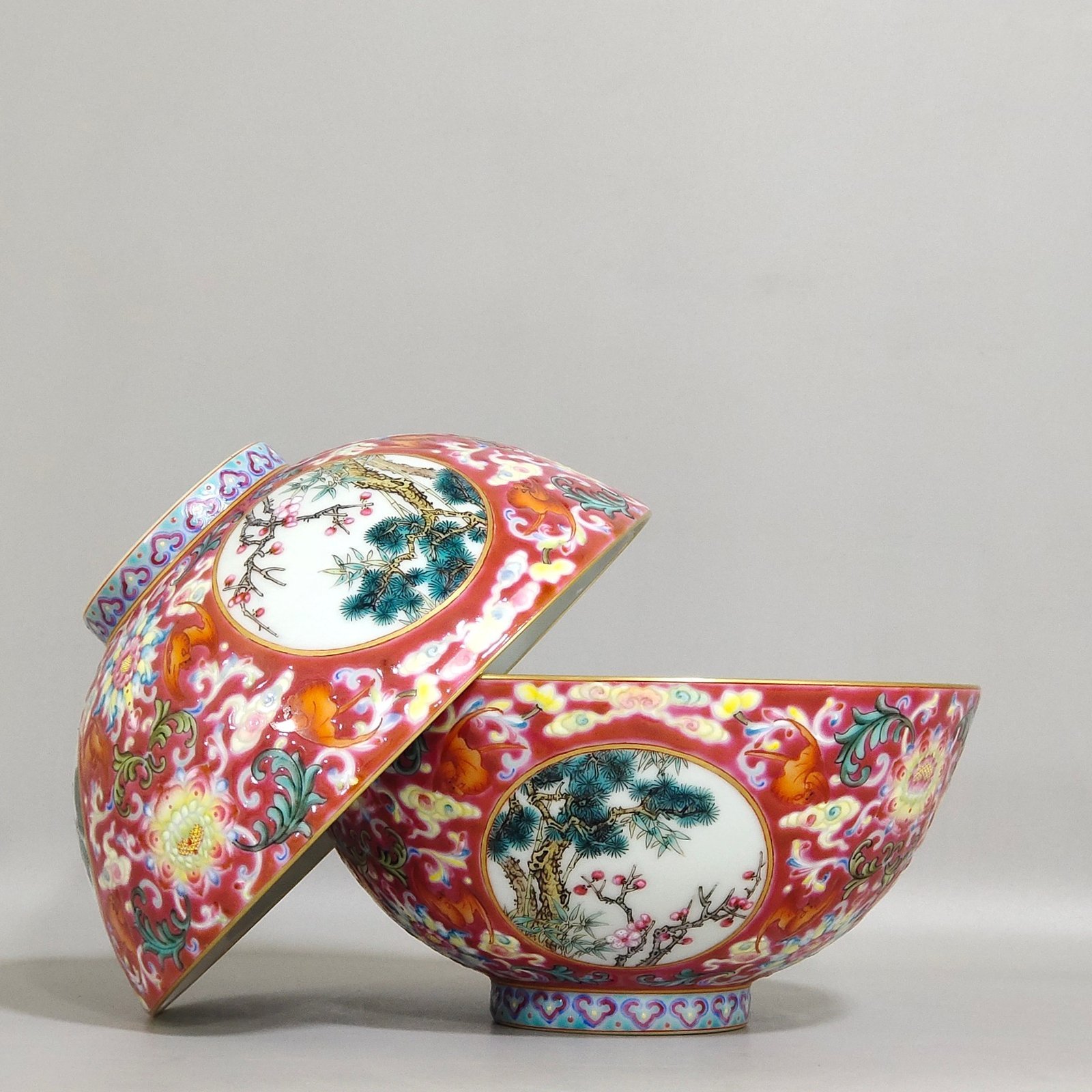 Qing Dynasty Yongzheng rouge ground blessing and longevity pine bamboo and plum bowl