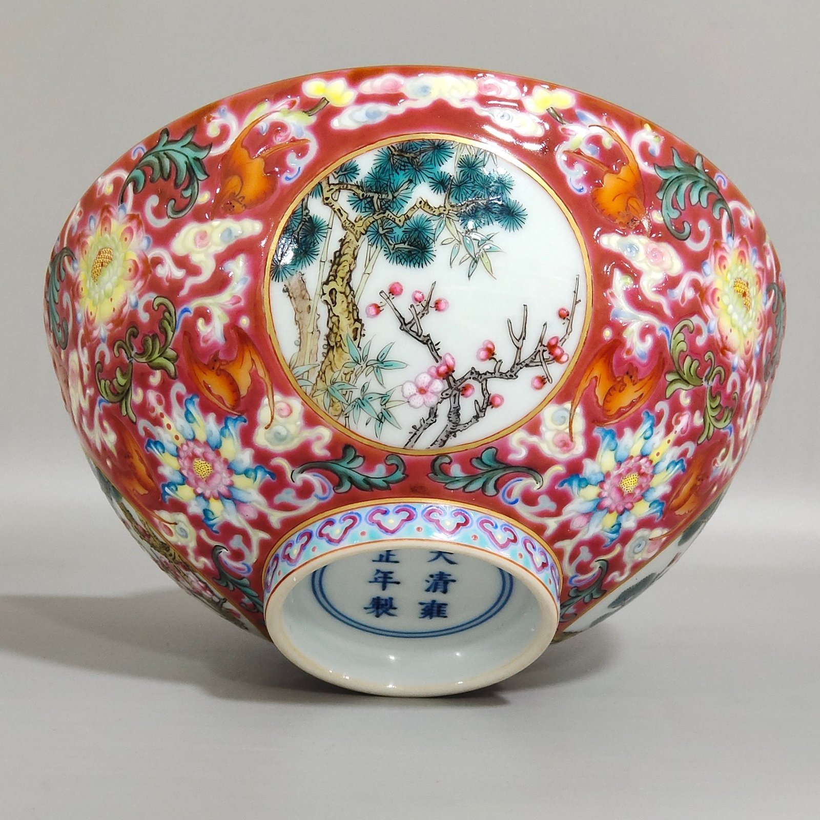 Qing Dynasty Yongzheng rouge ground blessing and longevity pine bamboo and plum bowl