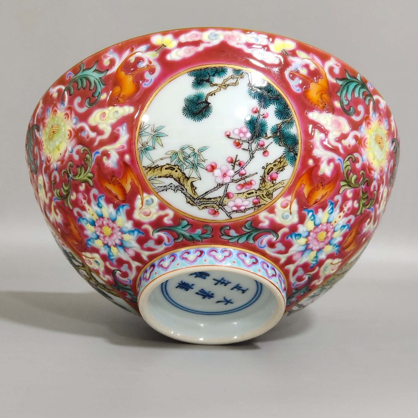 Qing Dynasty Yongzheng rouge ground blessing and longevity pine bamboo and plum bowl