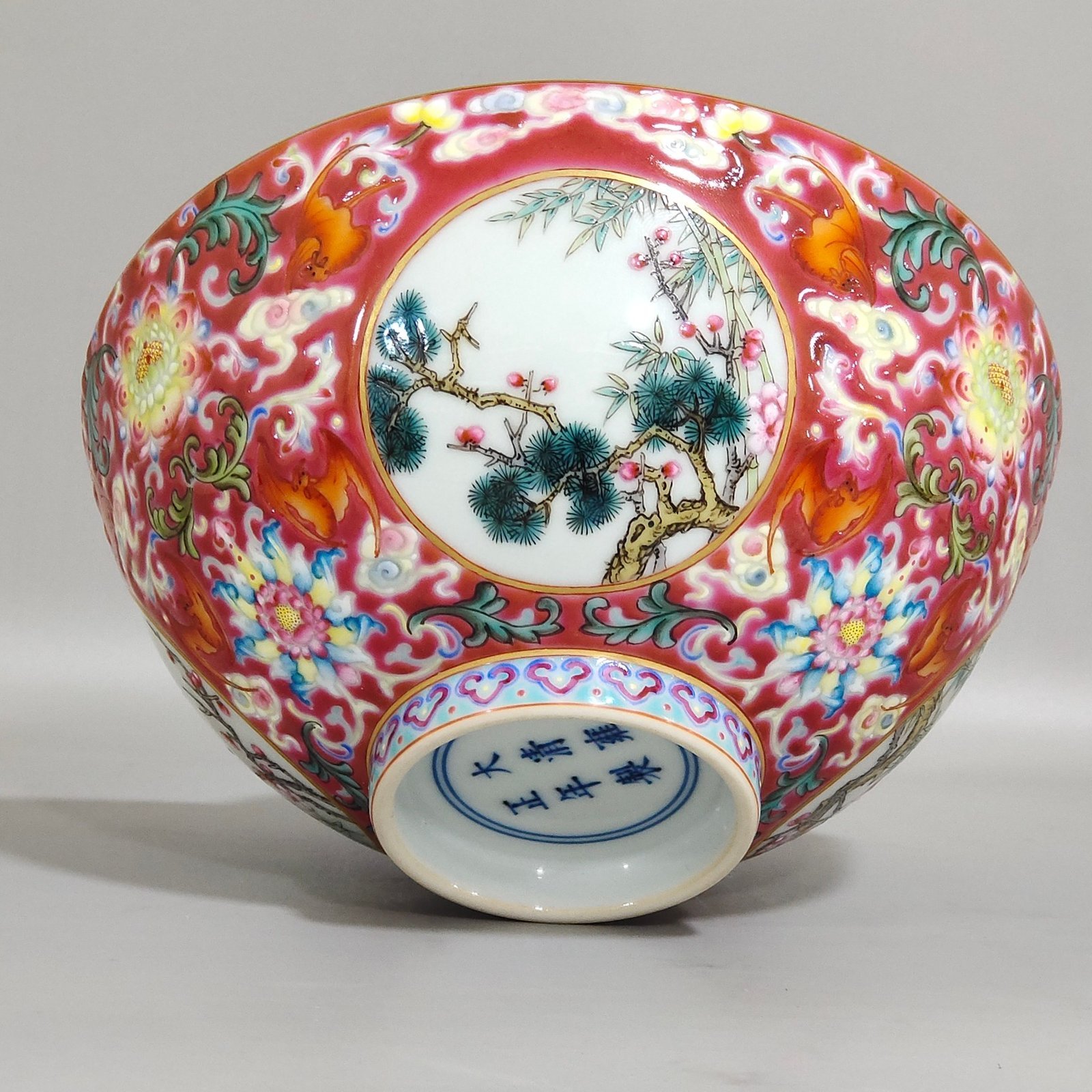 Qing Dynasty Yongzheng rouge ground blessing and longevity pine bamboo and plum bowl