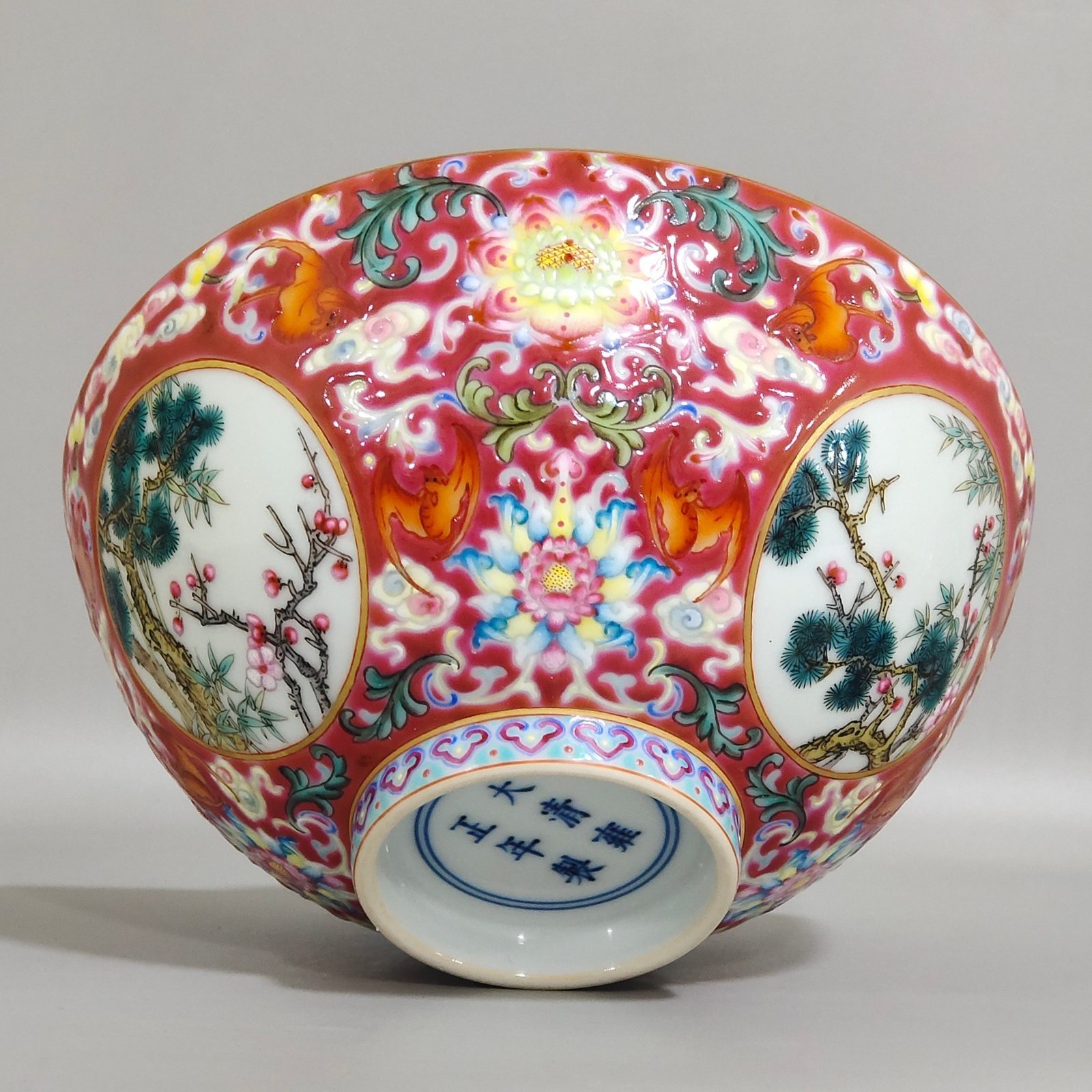 Qing Dynasty Yongzheng rouge ground blessing and longevity pine bamboo and plum bowl