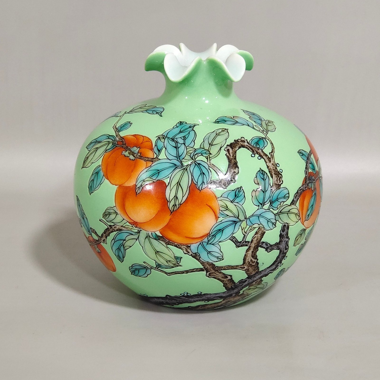 Qing Dynasty Yongzheng A green-glazed apple persimmon and pomegranate statue