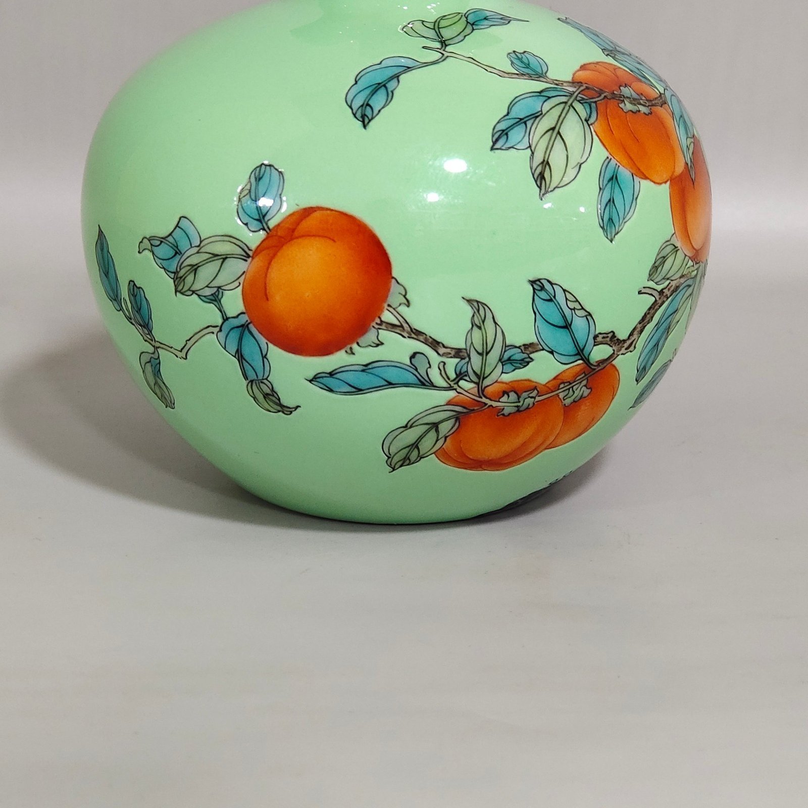 Qing Dynasty Yongzheng A green-glazed apple persimmon and pomegranate statue