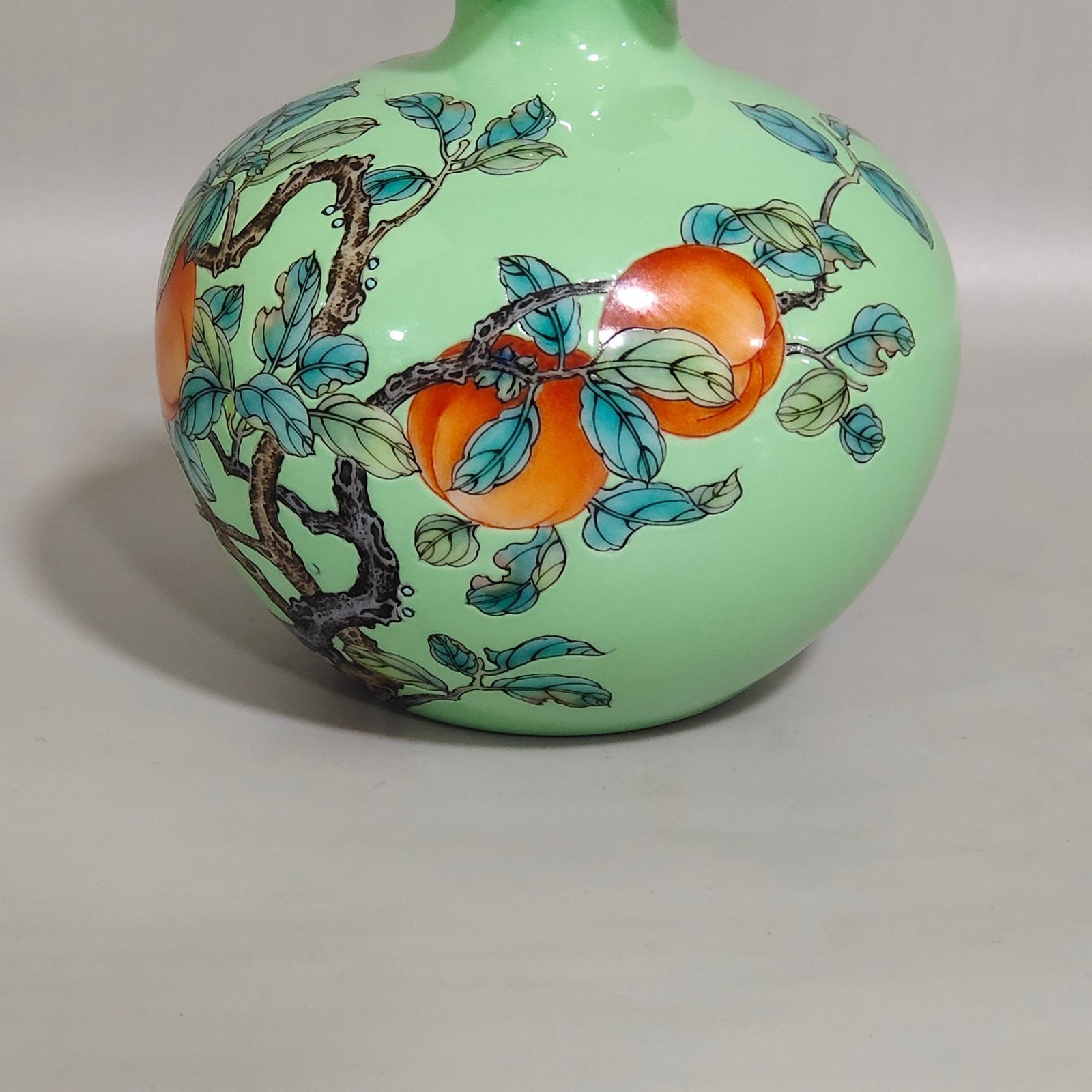 Qing Dynasty Yongzheng A green-glazed apple persimmon and pomegranate statue